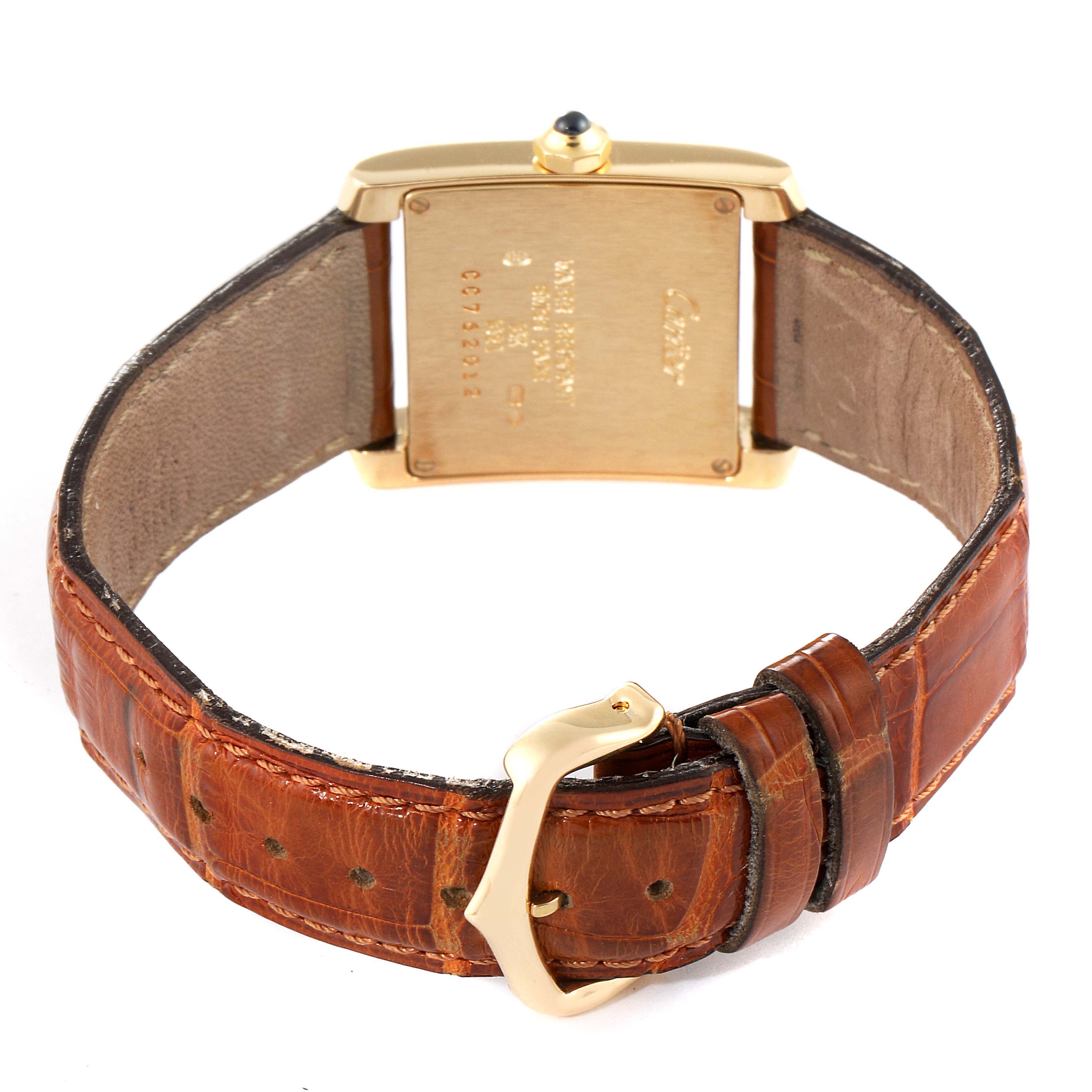 The image shows the back of a Cartier Tank Française watch, highlighting the case back, strap, and buckle.