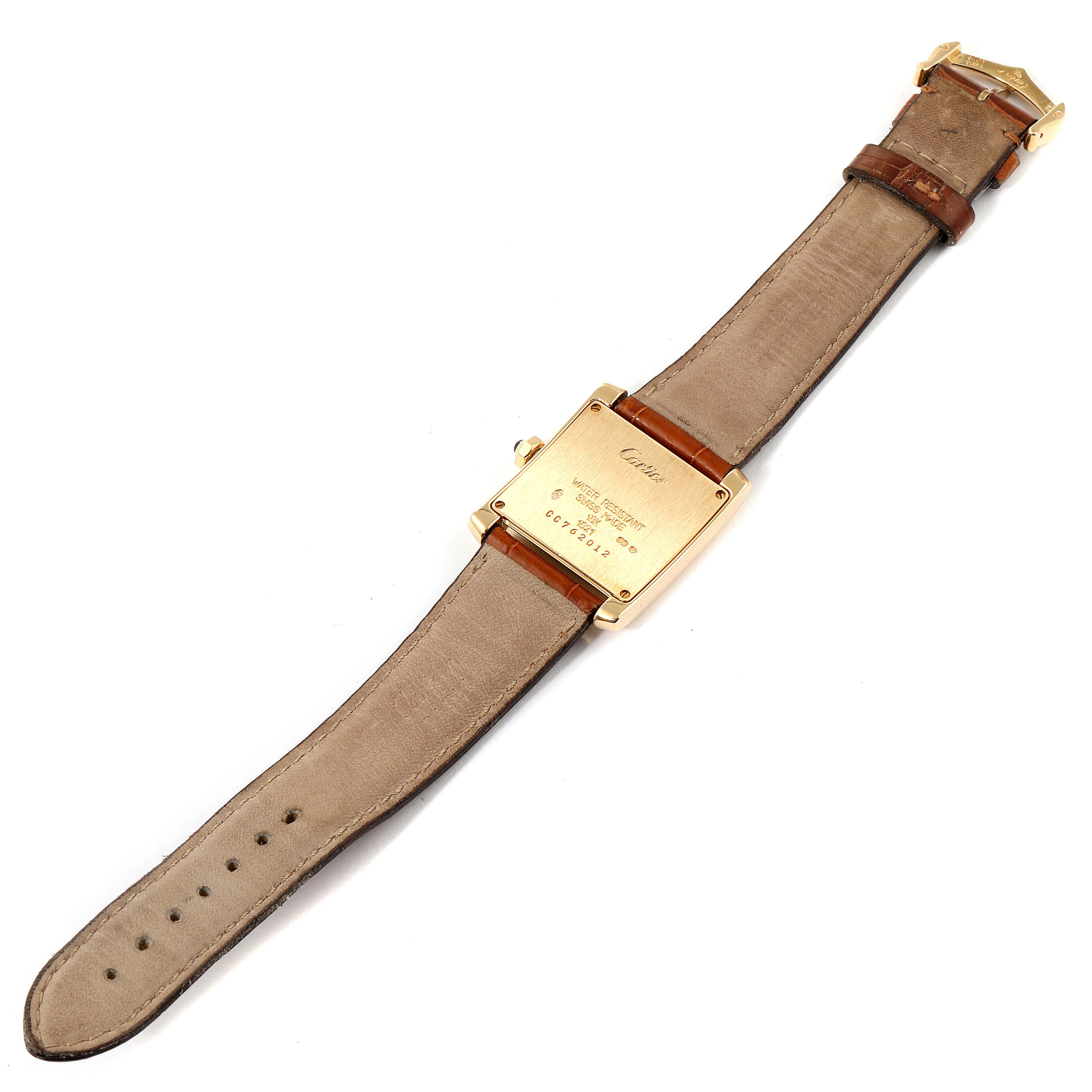 The image shows the back view of a Cartier Tank Française watch, highlighting the case back and leather strap.