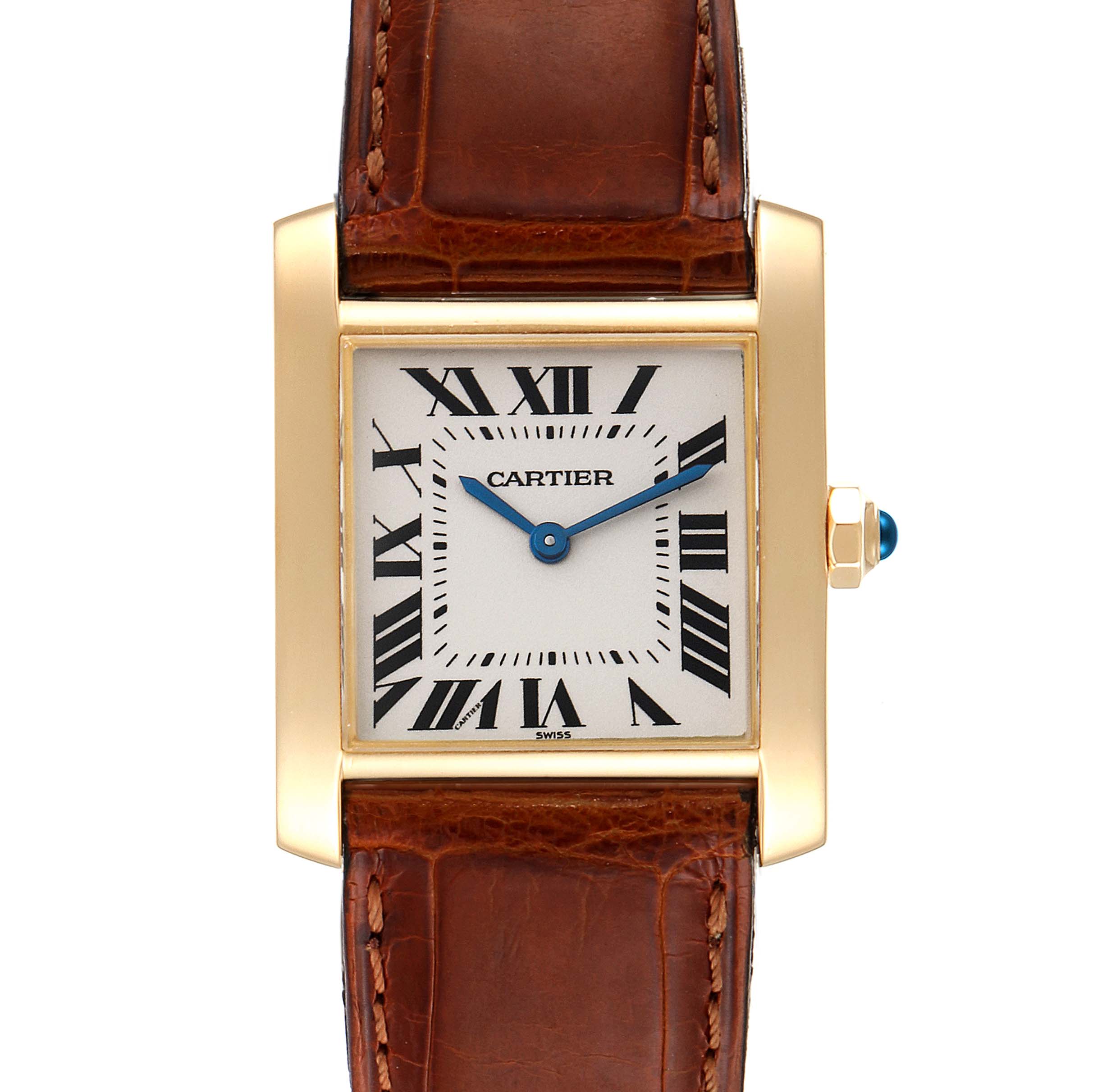 The image shows a close-up of the Cartier Tank Francaise W5000356 Women
s Yellow Gold Silver Dial W5000356 Women
s Yellow Gold Silver Dial watch, displaying its face, crown, and brown leather strap.