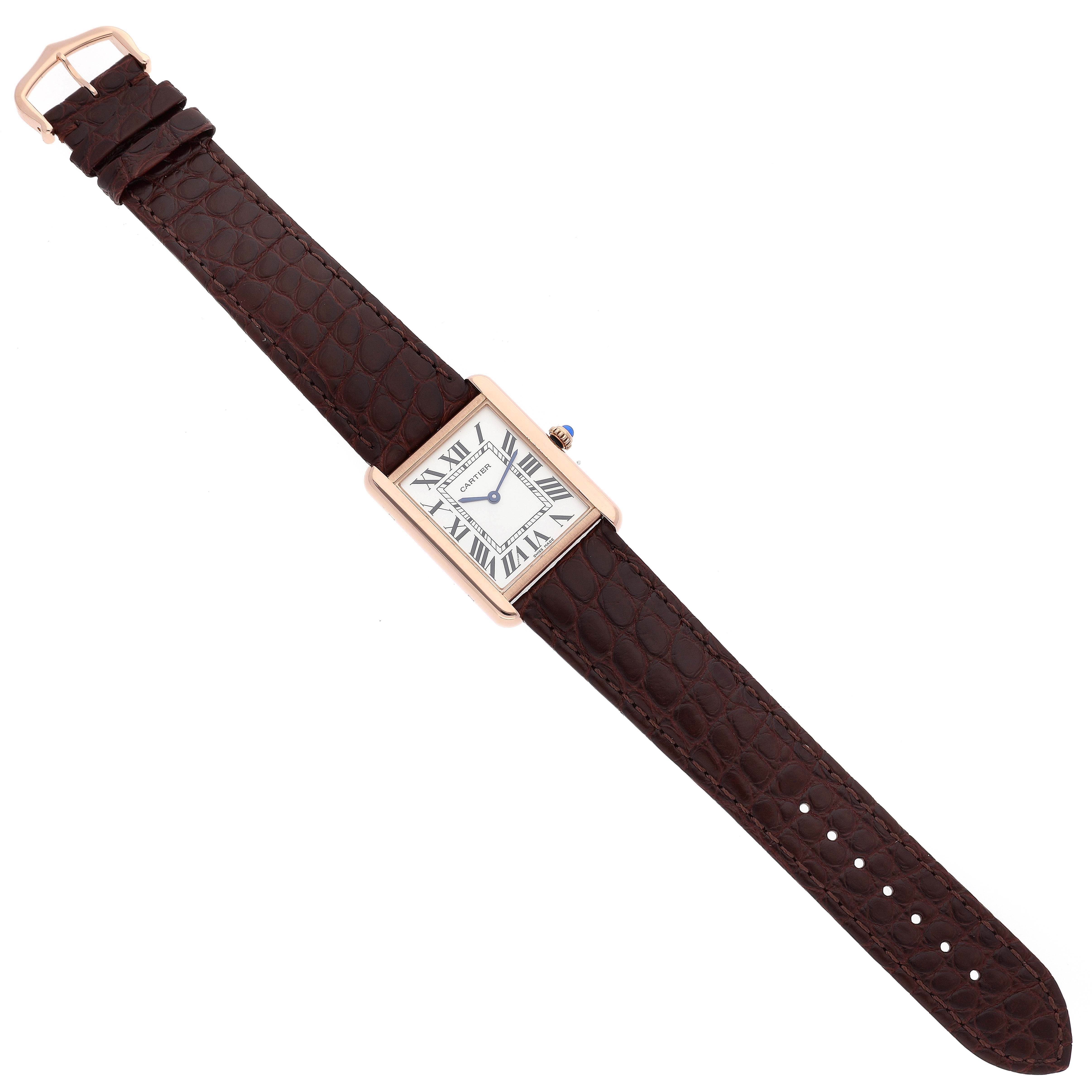 The Tank Solo model by Cartier is shown from a top-down angle, revealing the entire watch including the strap and face.