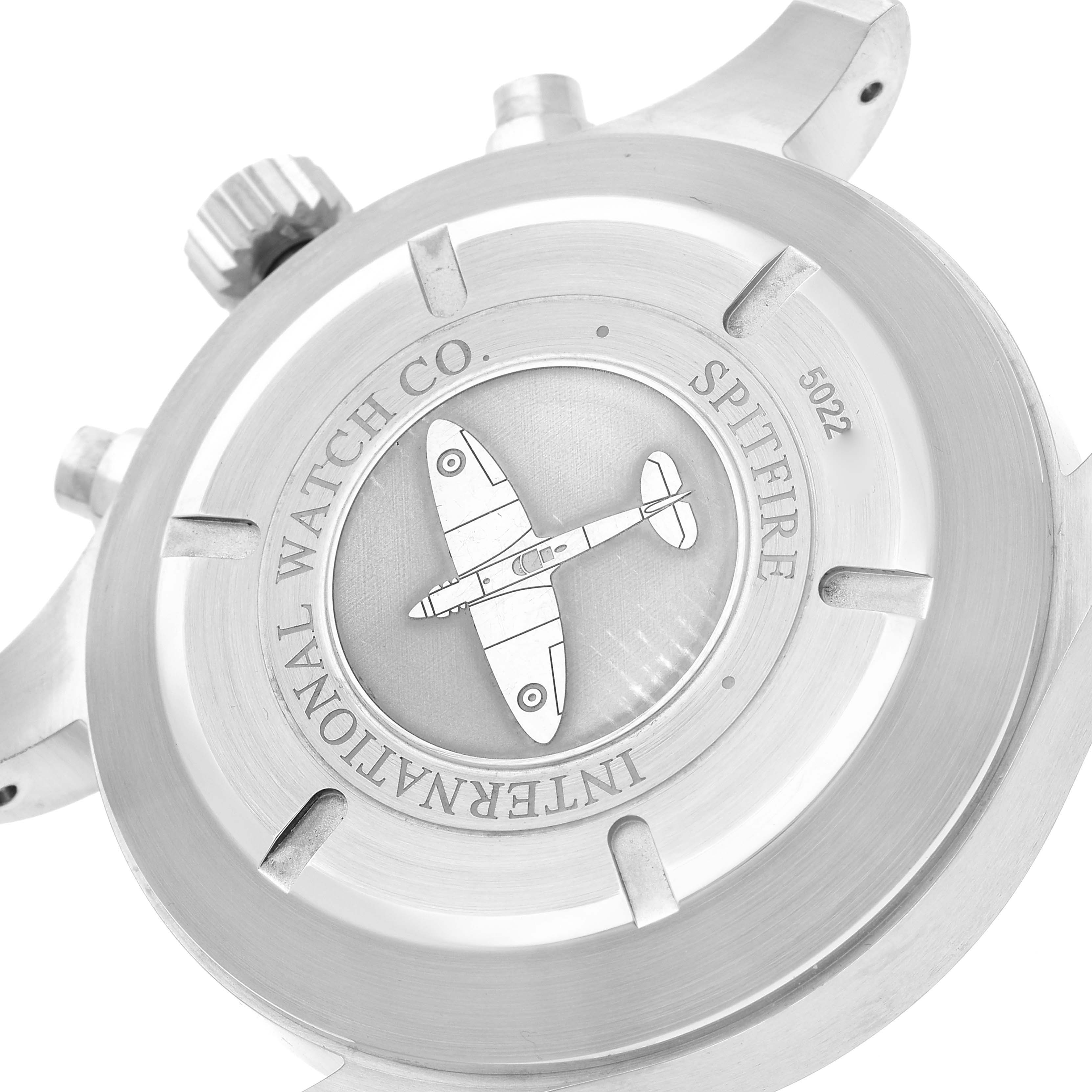 The image shows the case back of the IWC Pilot IW387802 Men's Stainless Steel Grey Dial IW387802 Men's Stainless Steel Grey Dial model watch, highlighting the Spitfire engraving and brand name.
