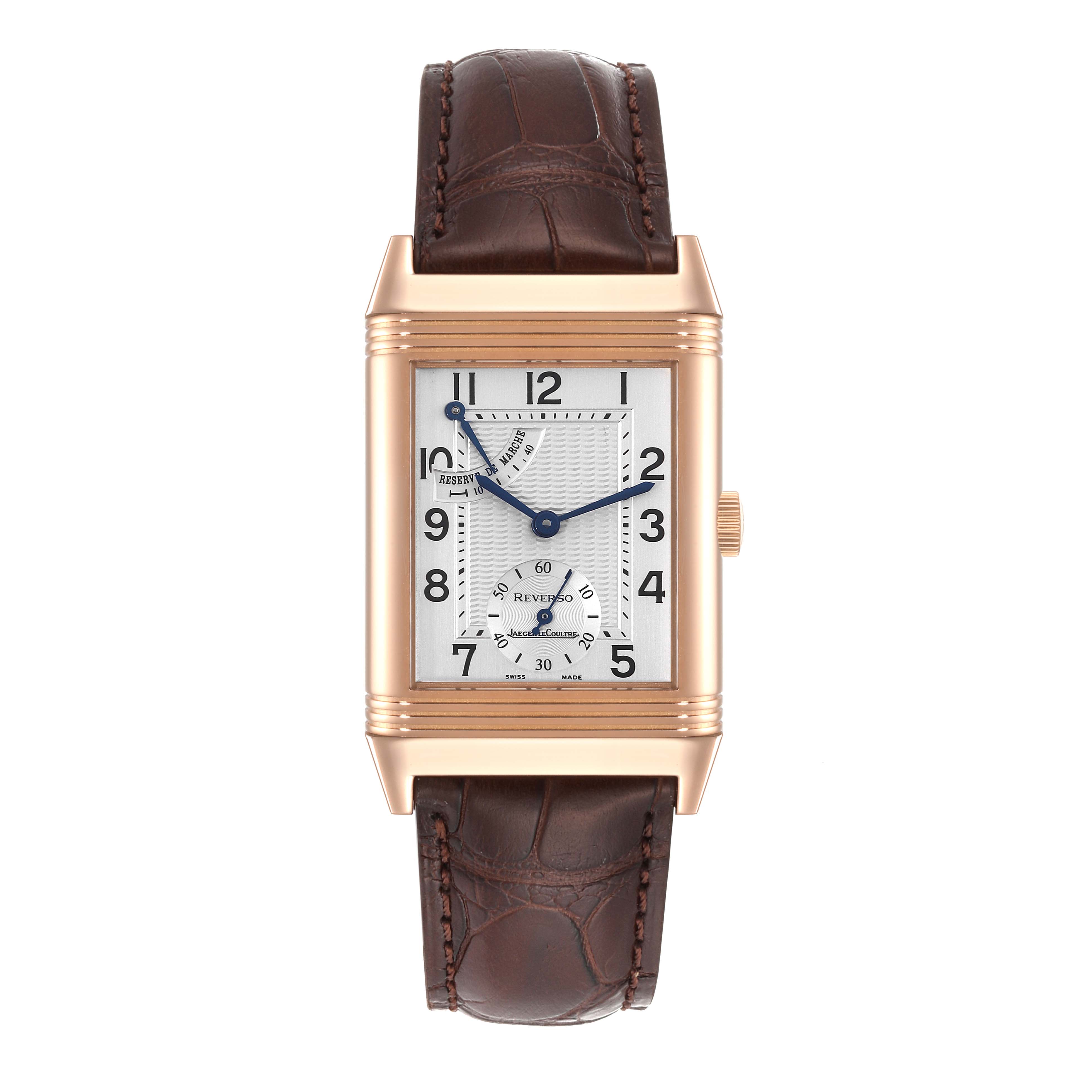 The image shows a frontal view of a Jaeger LeCoultre Reverso Q2702420 Men
s Rose Gold Silver Dial Q2702420 Men
s Rose Gold Silver Dial watch with a brown leather strap and a rectangular dial.