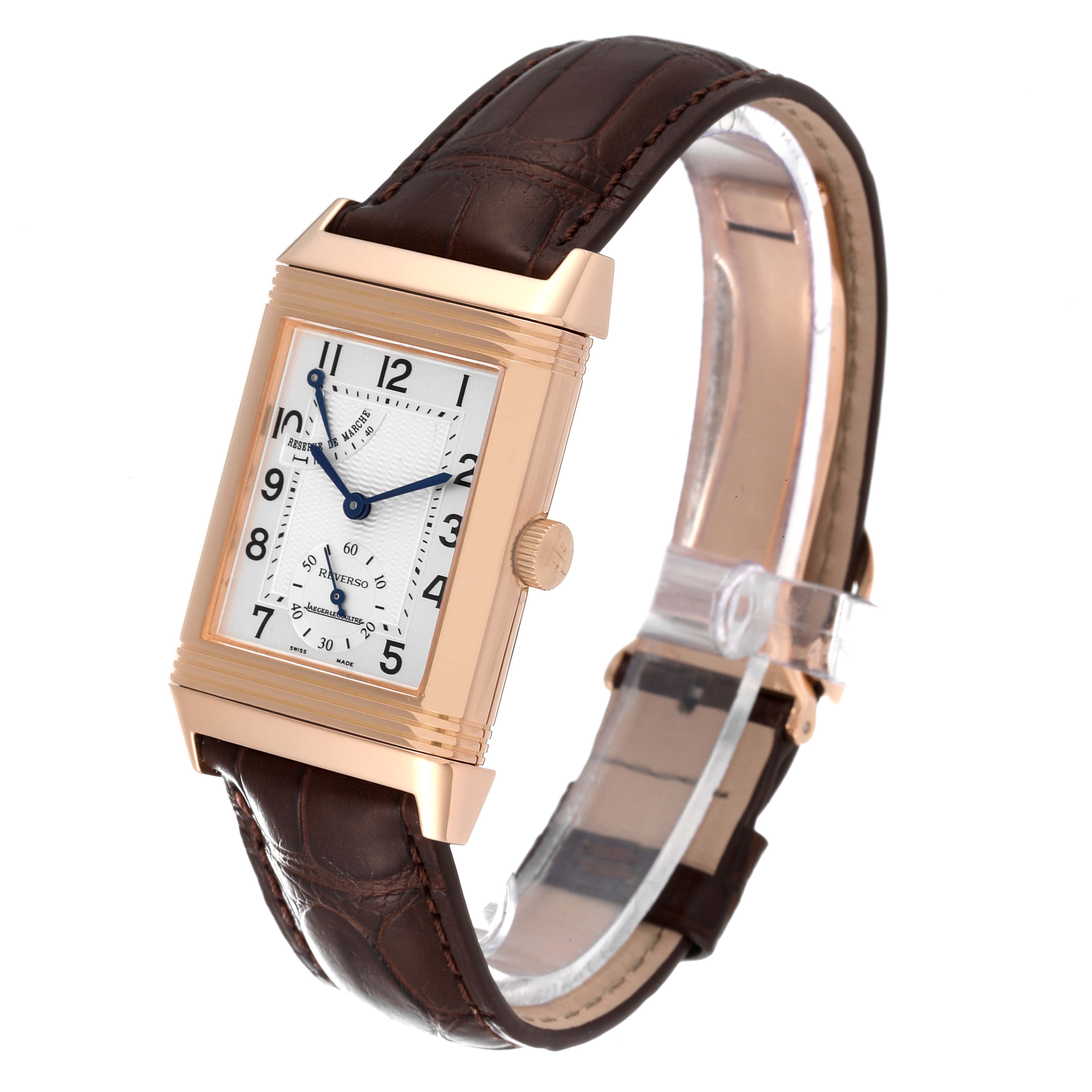 This image shows a Jaeger-LeCoultre Reverso watch at an angled view, highlighting the rectangular face and brown leather strap.