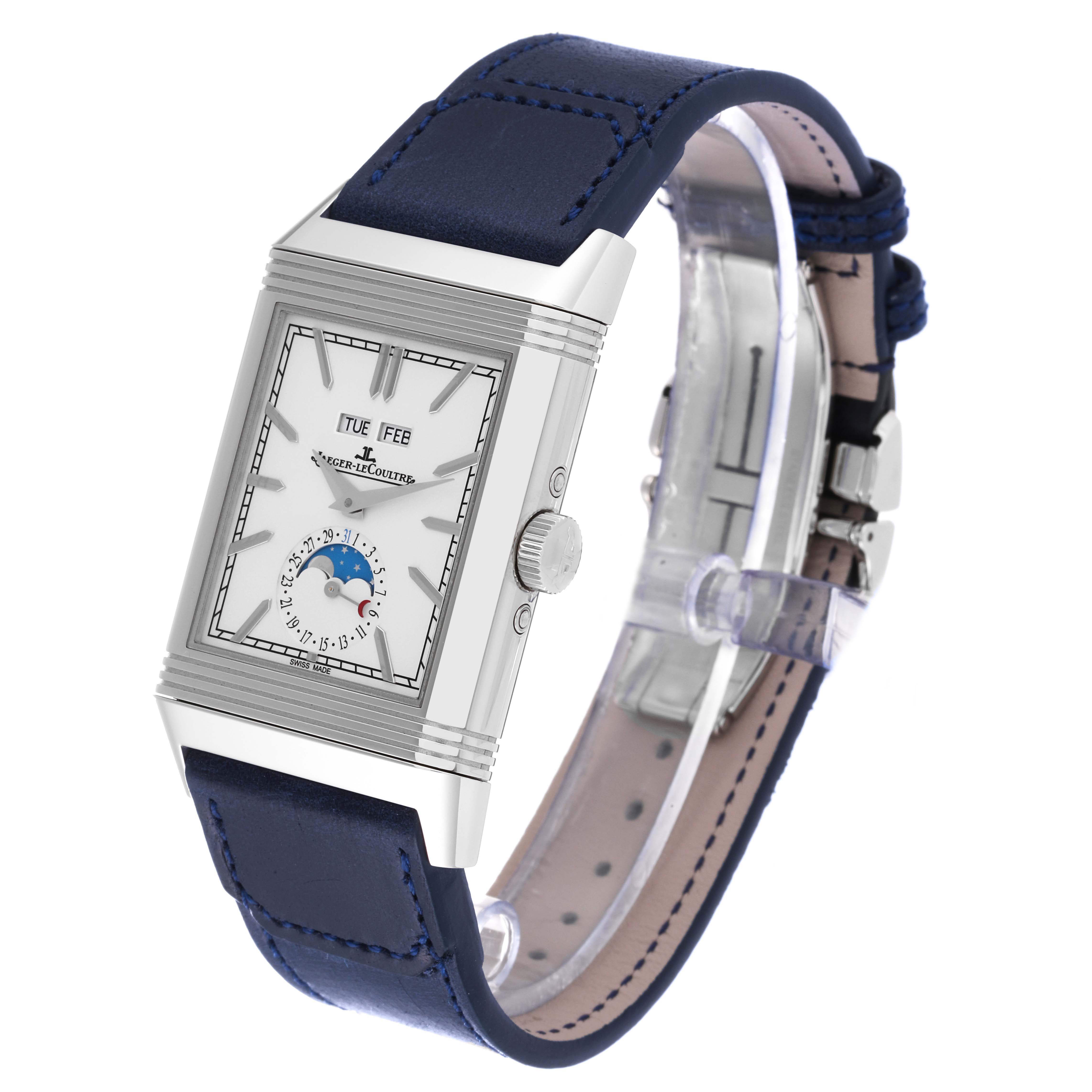 The image shows a front angled view of the Jaeger-LeCoultre Reverso watch, highlighting the dial, crown, and blue leather strap.