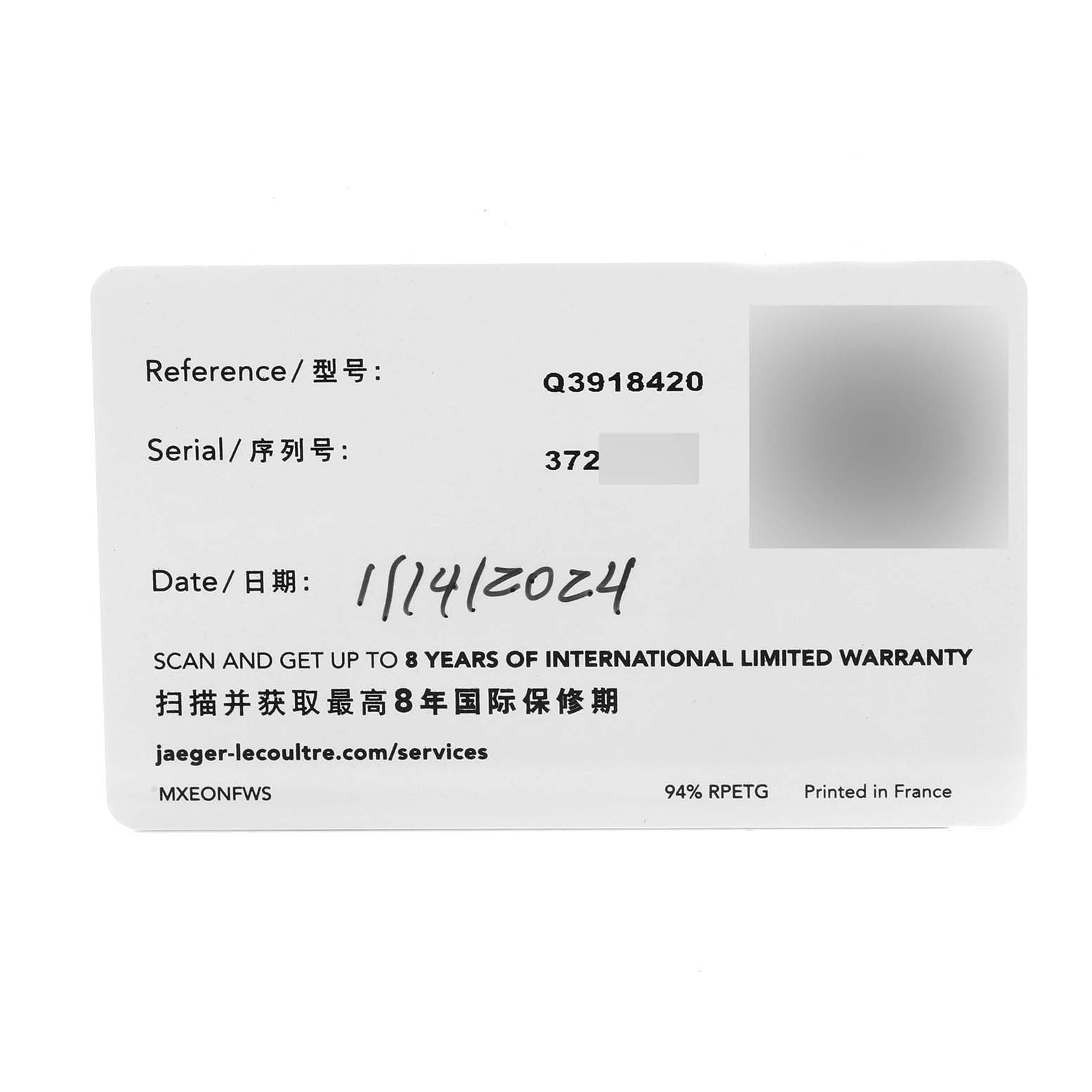 The image shows an international limited warranty card for the Jaeger-LeCoultre Reverso model, providing details like reference number and serial number.