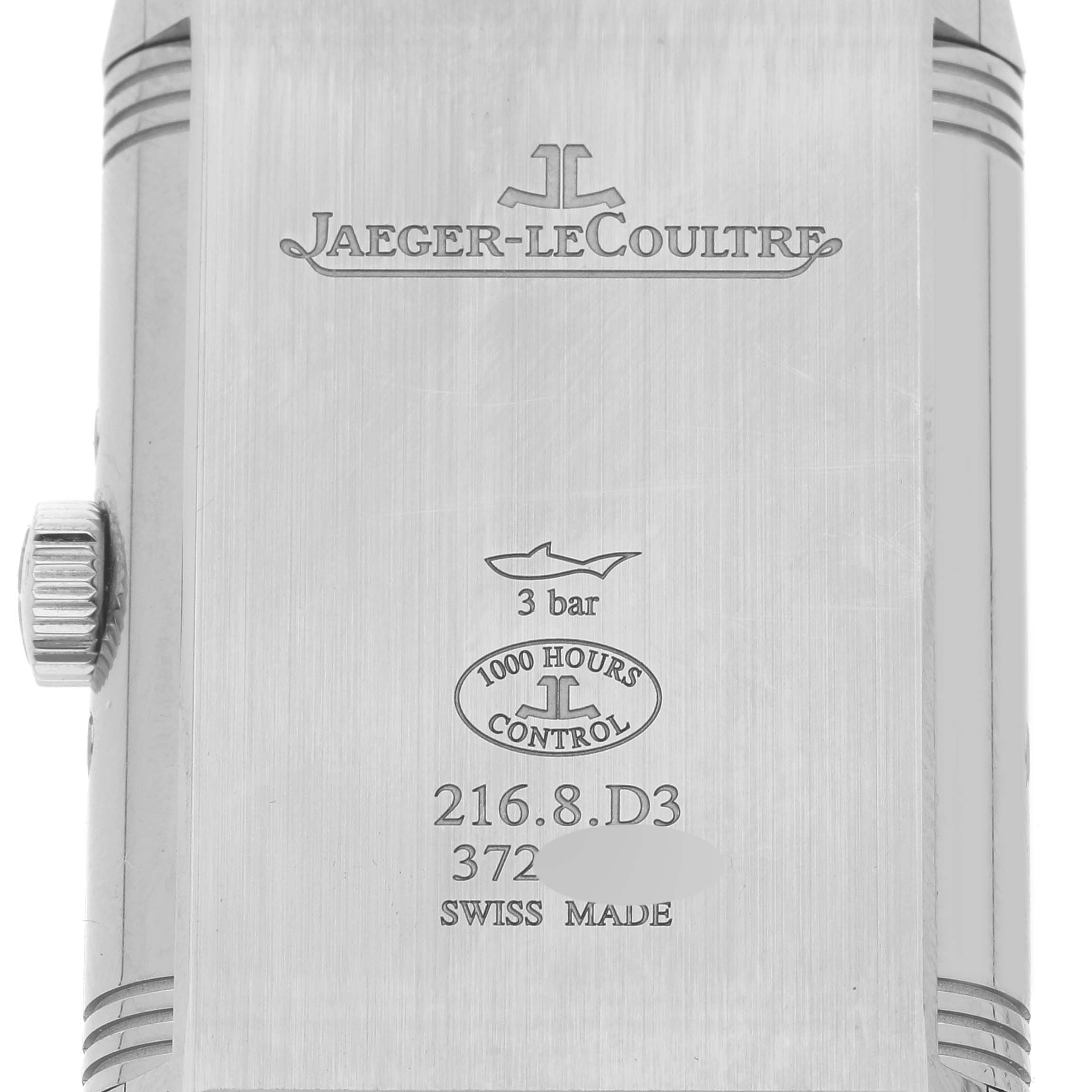 The image shows the back case of a Jaeger-LeCoultre Reverso watch, highlighting the branding, model number, and specifications.