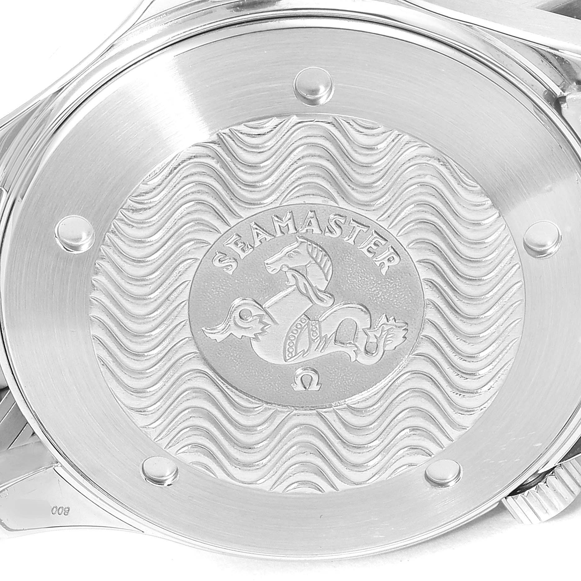 This image shows the case back of an Omega Seamaster 2254.50.00 Men
s Stainless Steel Black Dial 2254.50.00 Men
s Stainless Steel Black Dial watch with an engraved logo and wave pattern.