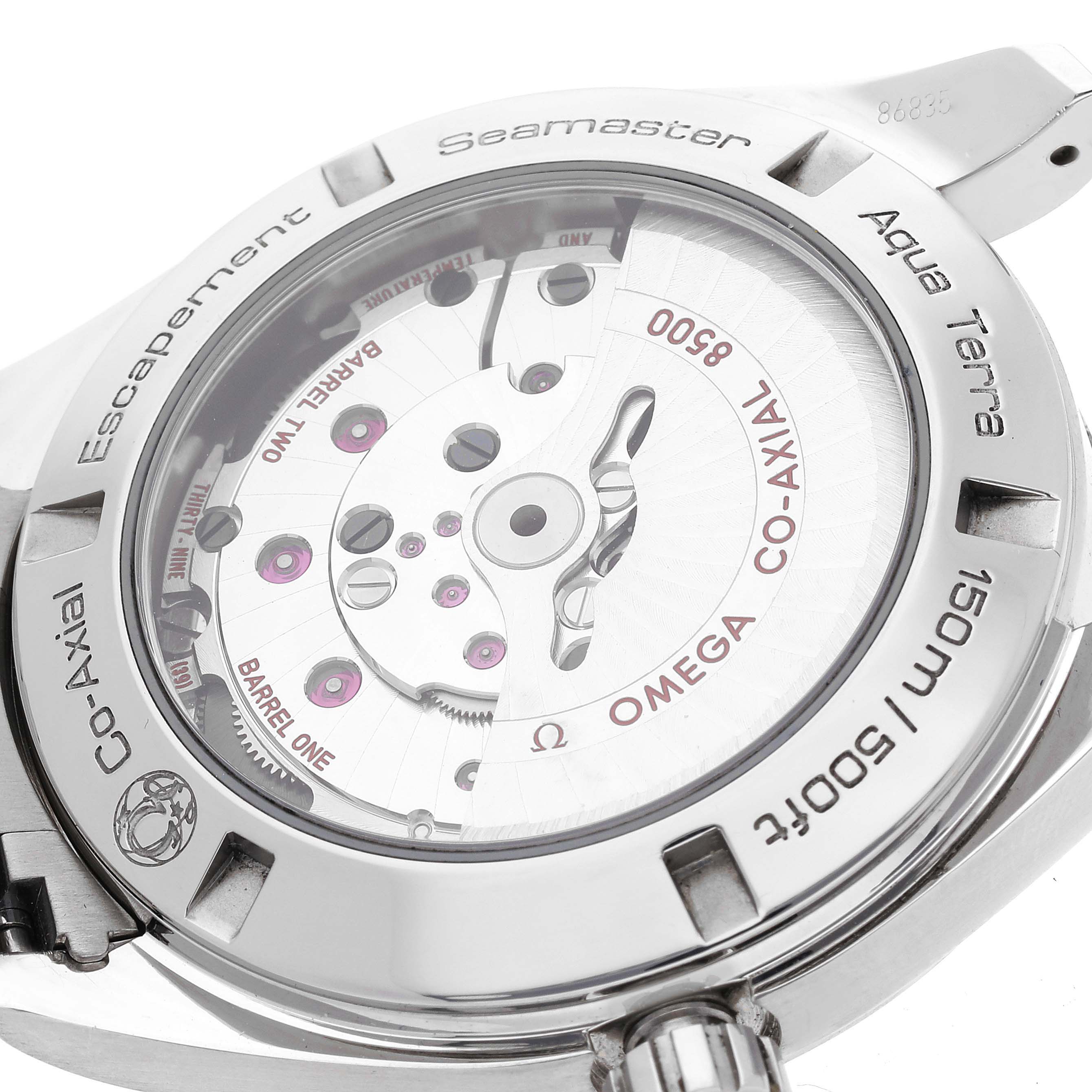 The image shows a close-up of the back of an Omega Aqua Terra 231.10.42.21.02.001 Men
s Stainless Steel Silver Dial 231.10.42.21.02.001 Men
s Stainless Steel Silver Dial Seamaster watch, highlighting the Co-Axial escapement mechanism.