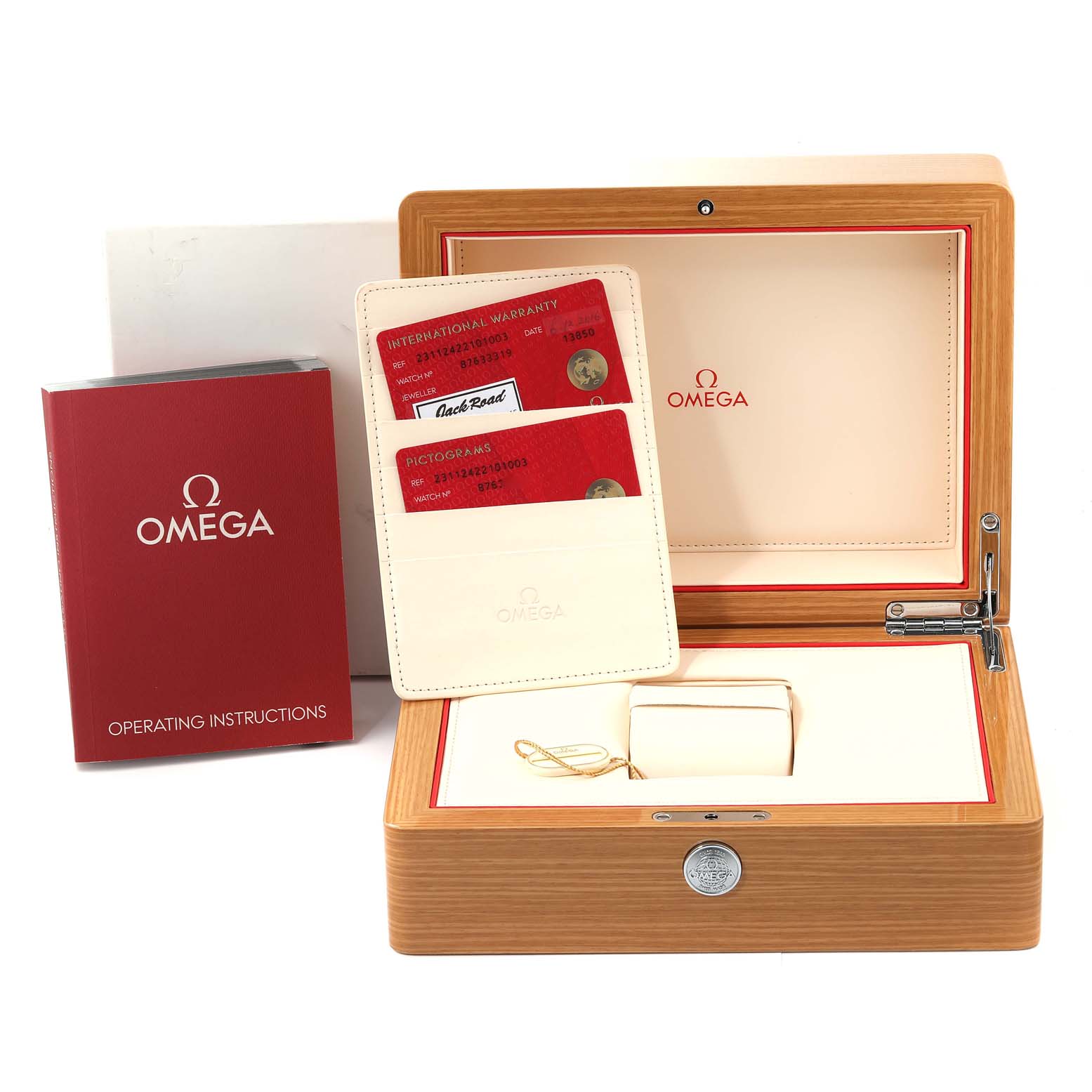 The image shows the accessories for an Omega Aqua Terra 231.12.42.21.01.003 Men's Stainless Steel Black Dial 231.12.42.21.01.003 Men's Stainless Steel Black Dial watch, including the box, warranty cards, and operating instructions.