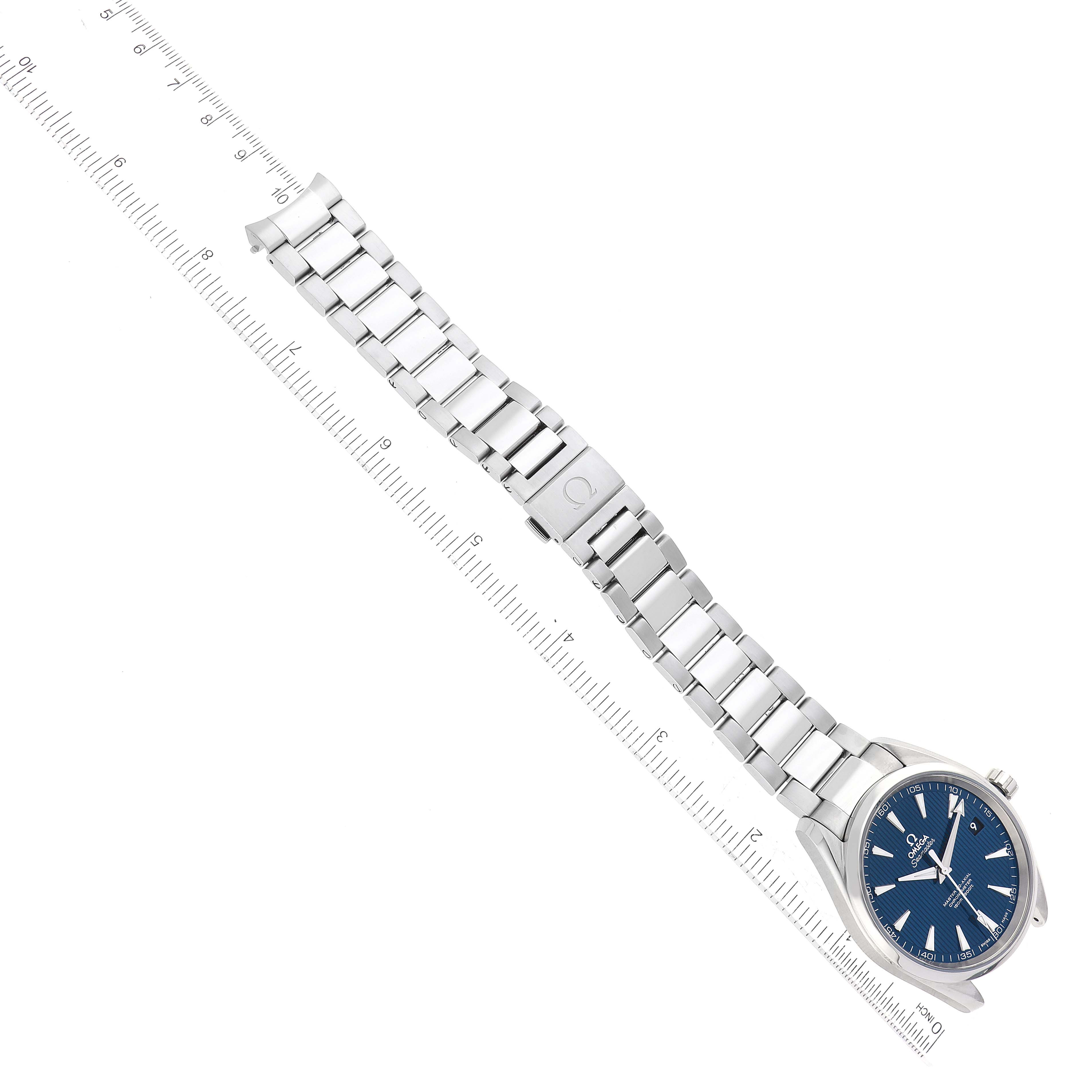 The Omega Aqua Terra 231.10.42.21.03.003 Men
s Stainless Steel Blue Dial 231.10.42.21.03.003 Men
s Stainless Steel Blue Dial watch is shown from a top-down angle, displaying the face and metal bracelet next to a ruler.
