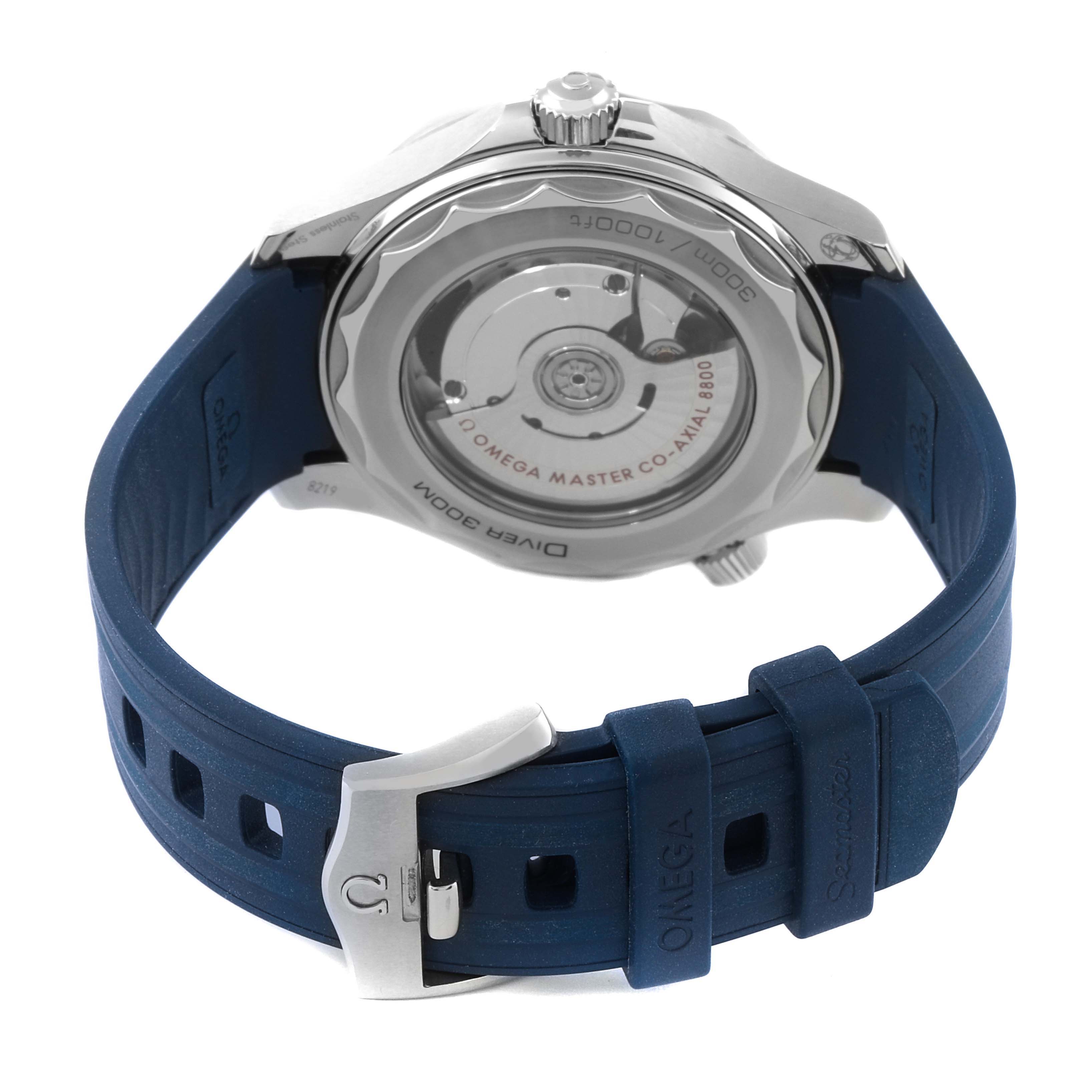 The image shows the back of an Omega Seamaster 210.32.42.20.06.001 Men's Stainless Steel Grey Dial 210.32.42.20.06.001 Men's Stainless Steel Grey Dial watch, displaying its movement through a transparent case back, and a blue rubber strap with a buckle.