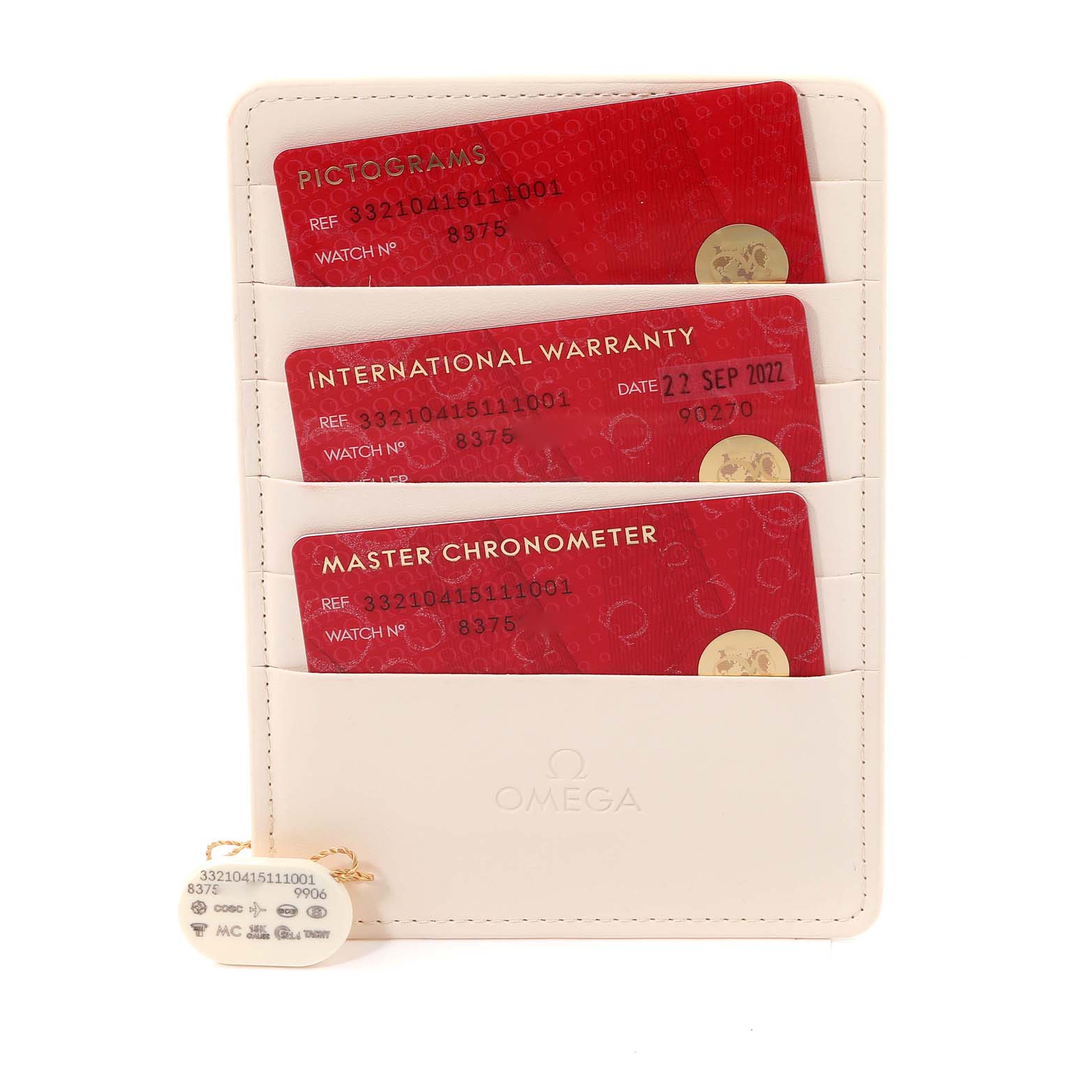 The image shows warranty cards and documentation for an Omega Speedmaster 332.10.41.51.11.001 Men's Stainless Steel Red Dial 332.10.41.51.11.001 Men's Stainless Steel Red Dial, including pictograms, international warranty, and master chronometer cards.