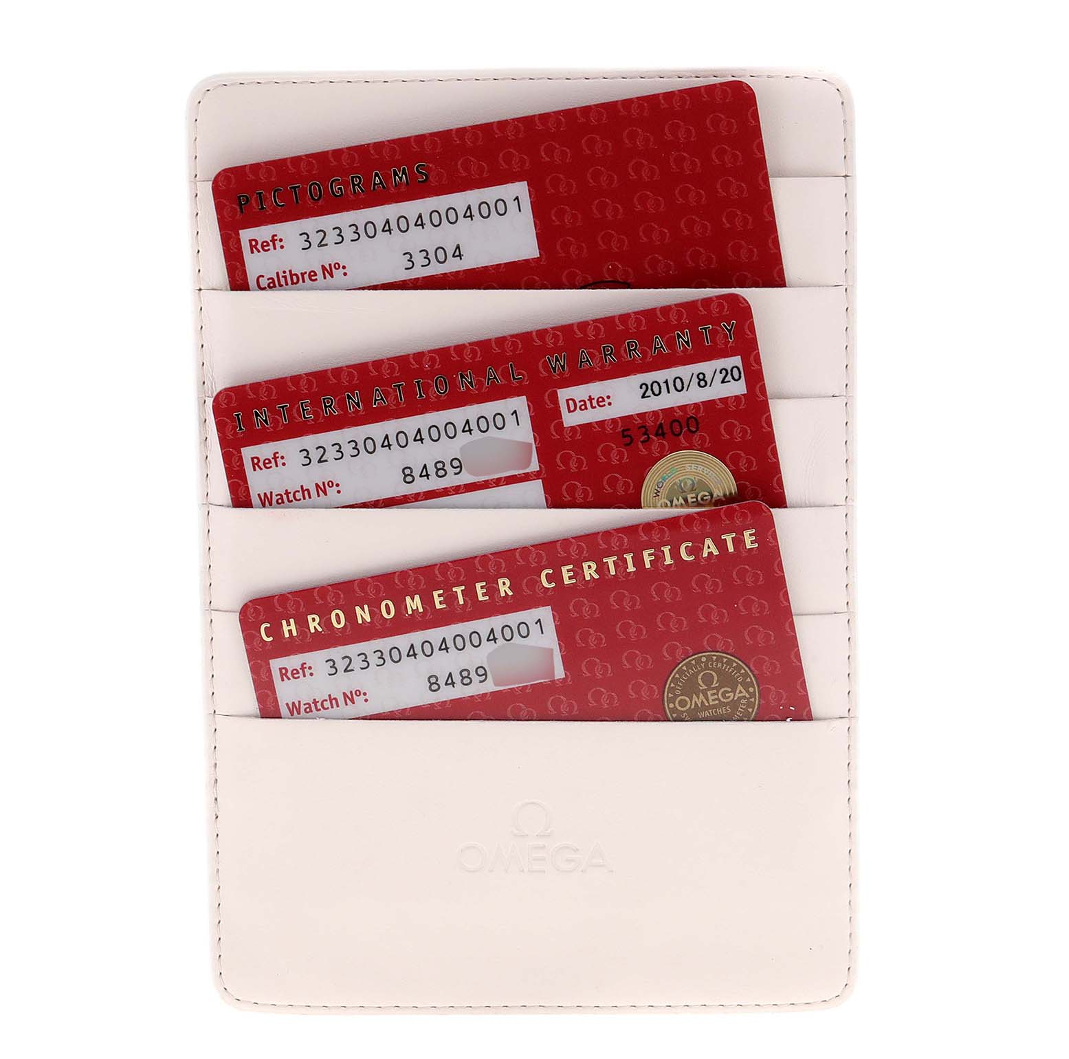 This image shows the Omega Speedmaster 323.30.40.40.04.001 Men's Stainless Steel White Dial 323.30.40.40.04.001 Men's Stainless Steel White Dial's warranty and certificate cards in a holder viewed from above.