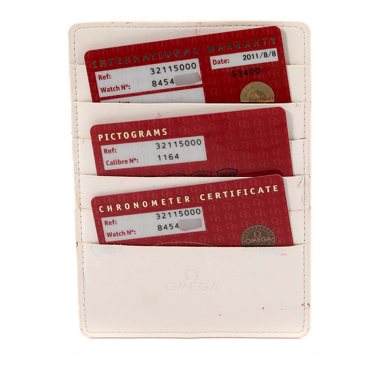 The image shows three Omega Speedmaster 3511.50.00 Men
s Stainless Steel Black Dial 3511.50.00 Men
s Stainless Steel Black Dial cards: International Warranty, Pictograms, and Chronometer Certificate in a cardholder.