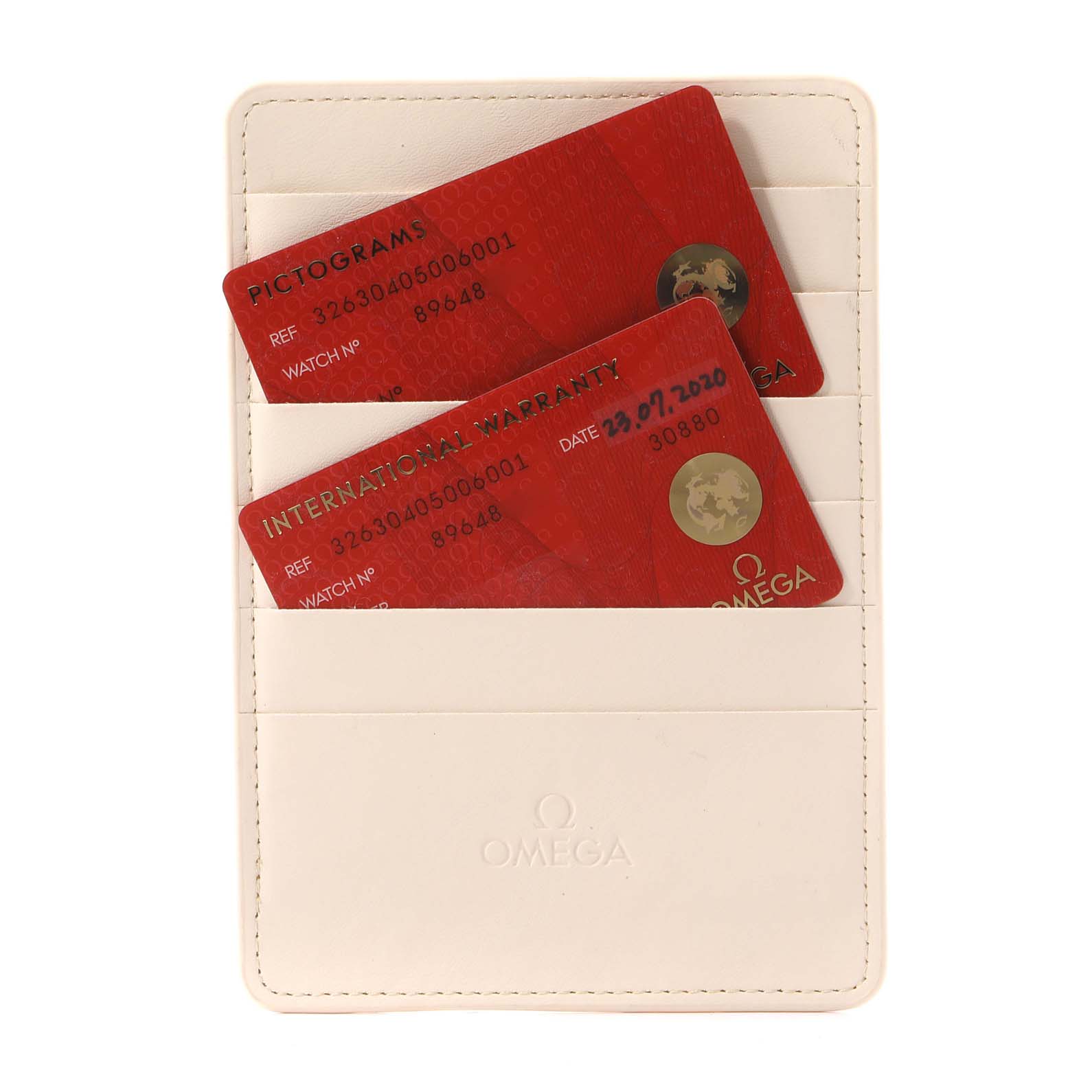 The image shows warranty cards in a holder for the Omega Speedmaster 326.30.40.50.06.001 Men's Stainless Steel Grey Dial 326.30.40.50.06.001 Men's Stainless Steel Grey Dial watch model.