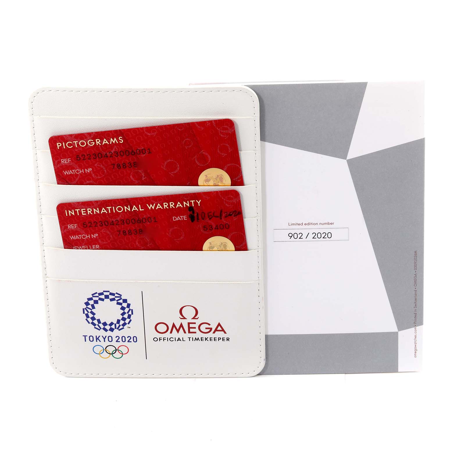 The image shows the warranty cards and packaging for an Omega Speedmaster 522.30.42.30.06.001 Men's Stainless Steel Silver Dial 522.30.42.30.06.001 Men's Stainless Steel Silver Dial watch, including limited edition details.