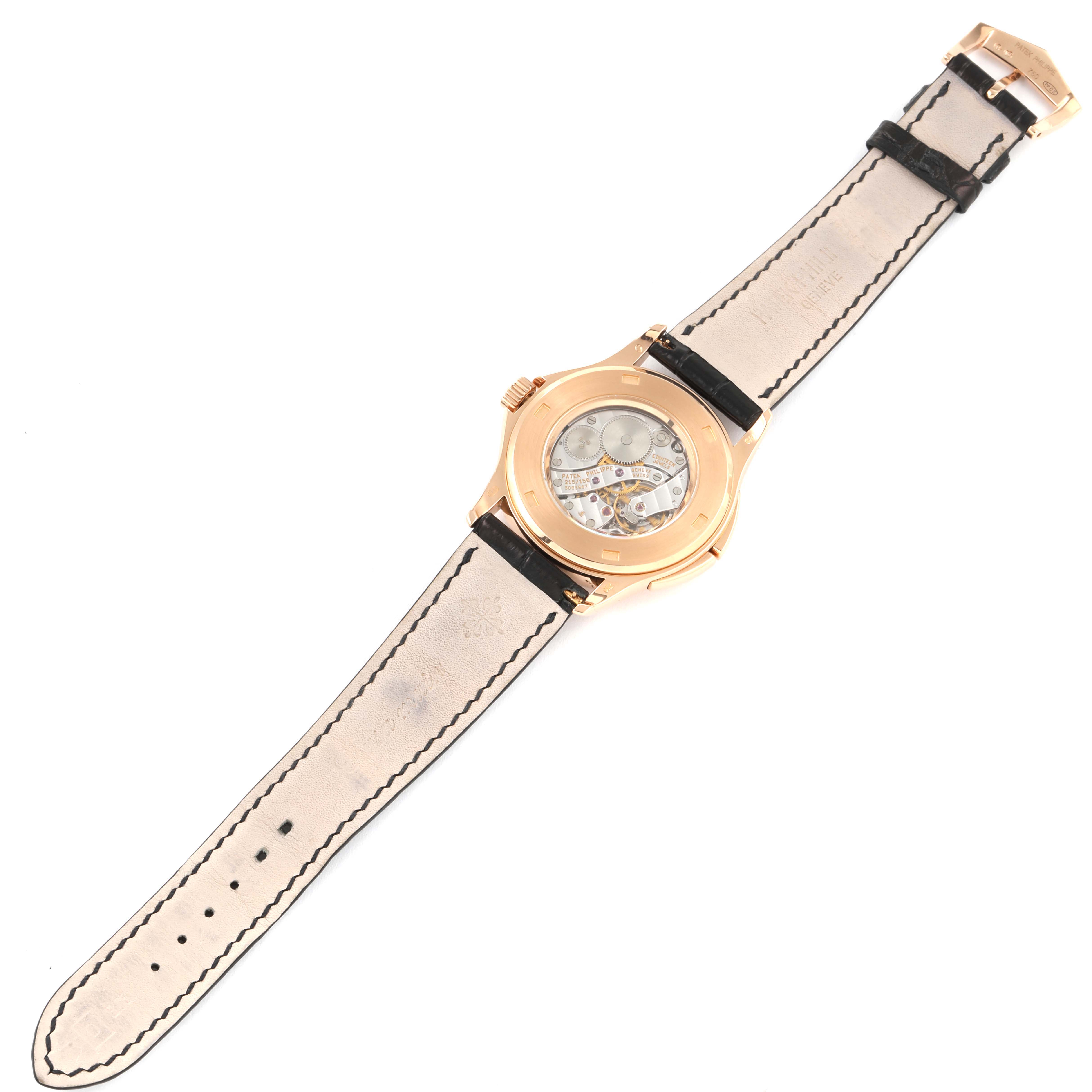 The image shows the back view of a Patek Philippe Calatrava 5134R Men's Rose Gold White Dial 5134R Men's Rose Gold White Dial watch, highlighting its movement and leather strap.