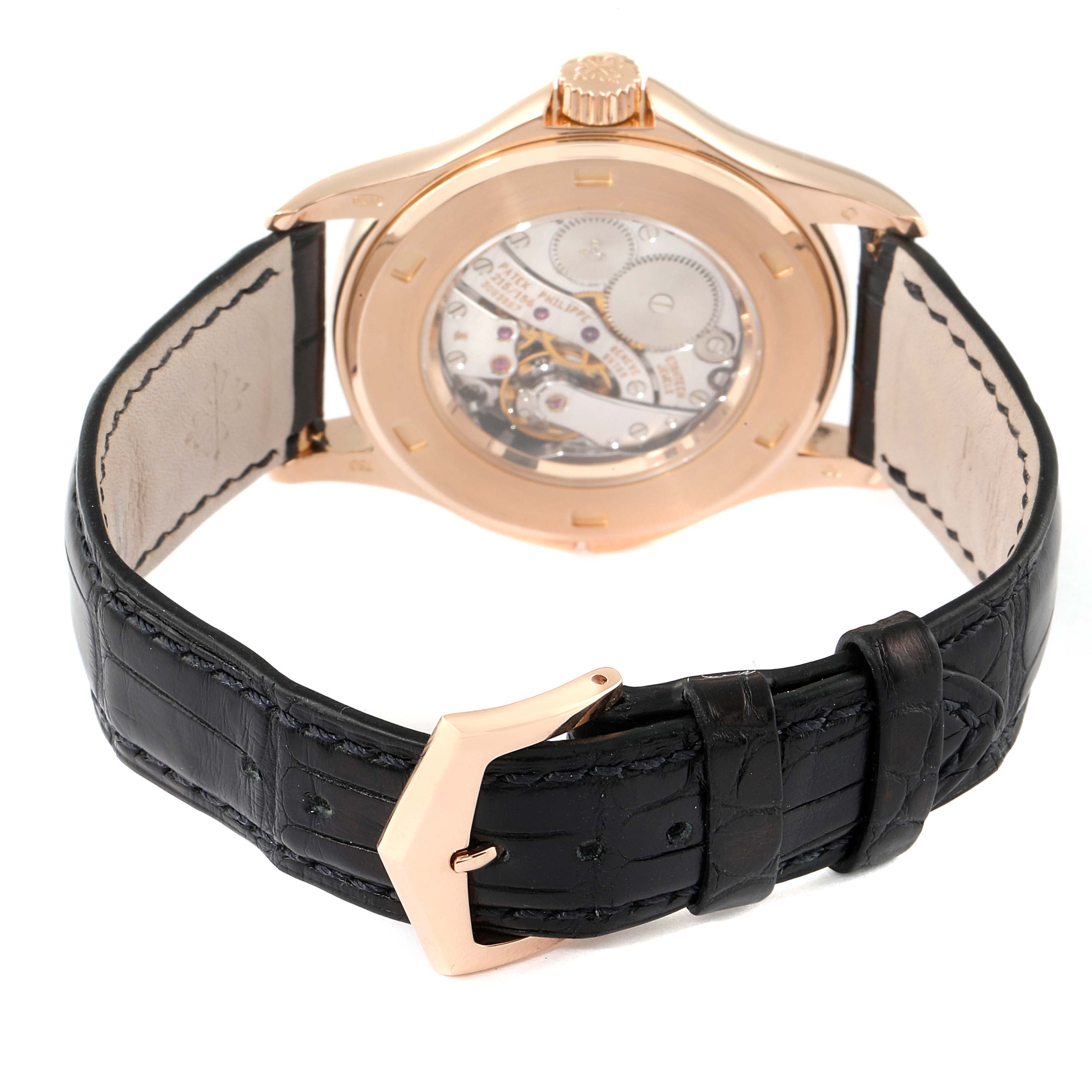 The image shows the back view of a Patek Philippe Calatrava 5134R Men's Rose Gold White Dial 5134R Men's Rose Gold White Dial, featuring its transparent case back and black leather strap.