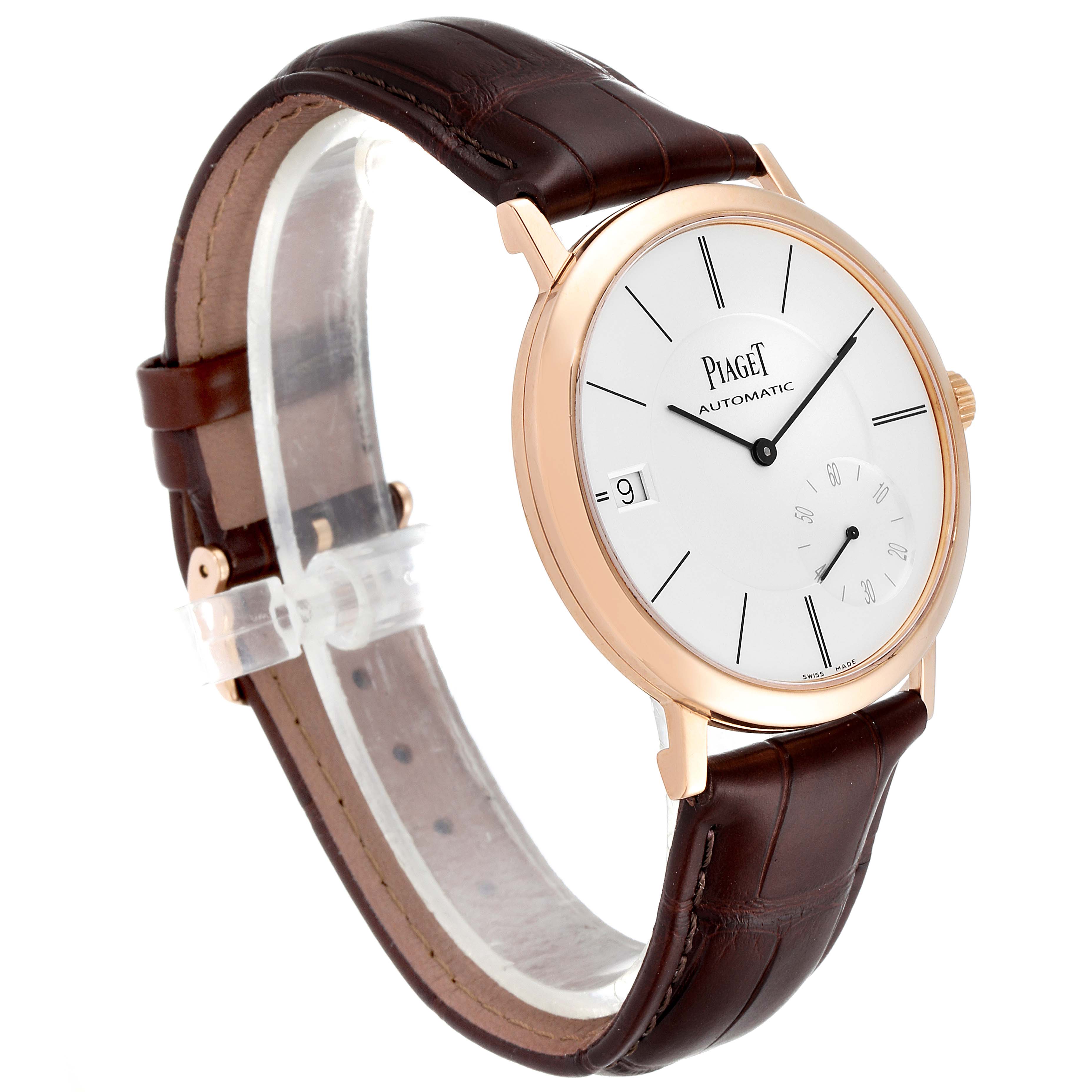 The Piaget G0A38131 Men's Rose Gold Silver Dial G0A38131 Men's Rose Gold Silver Dial Altiplano GOA38131 watch is angled to show the face, rose gold case, crown, and brown leather strap.