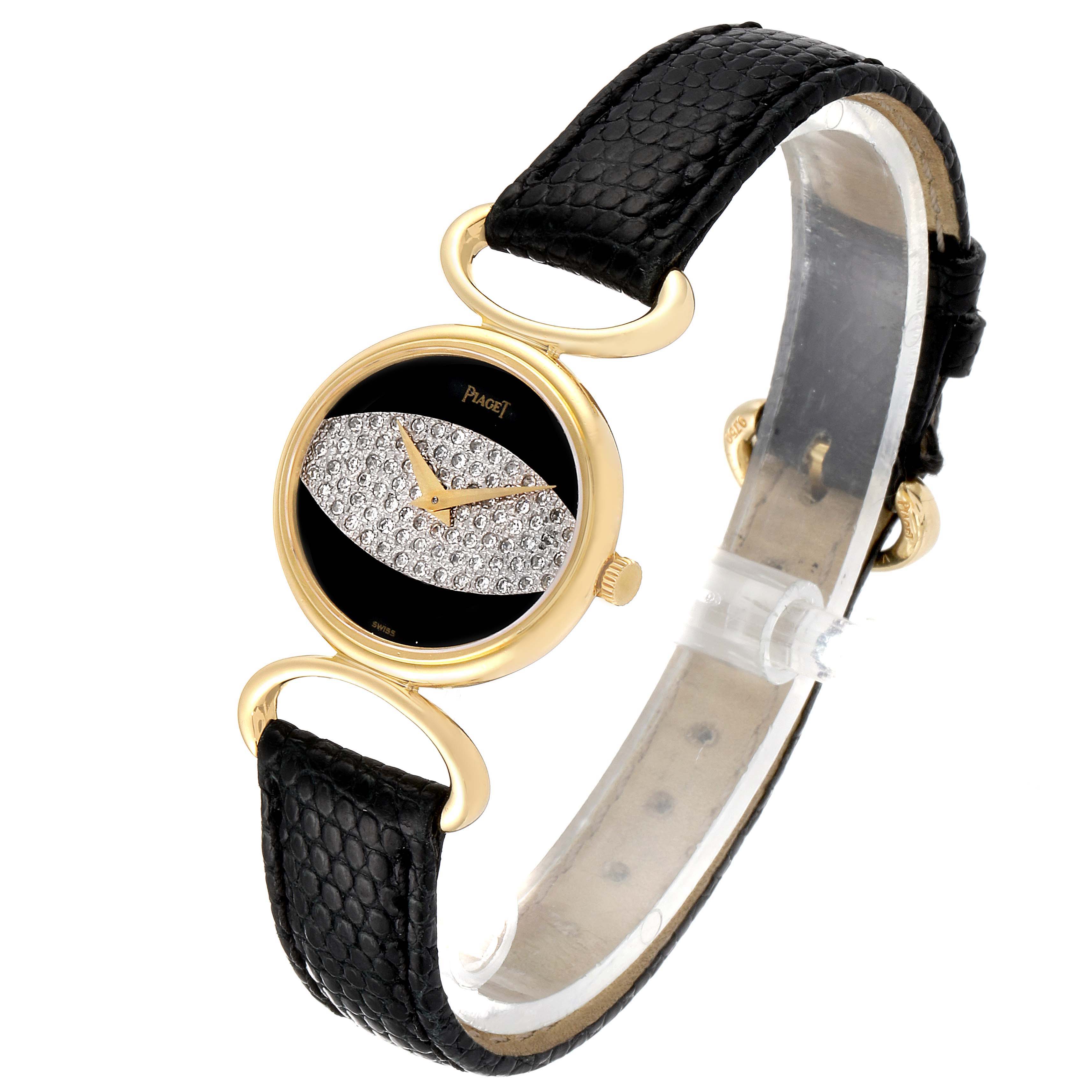 The image shows a Piaget 9802 Women's Yellow Gold Black Dial 9802 Women's Yellow Gold Black Dial Classique Yellow Gold Onix Diamond Dial Vintage Ladies Watch 9802 at a slight side angle, showcasing its dial and strap.