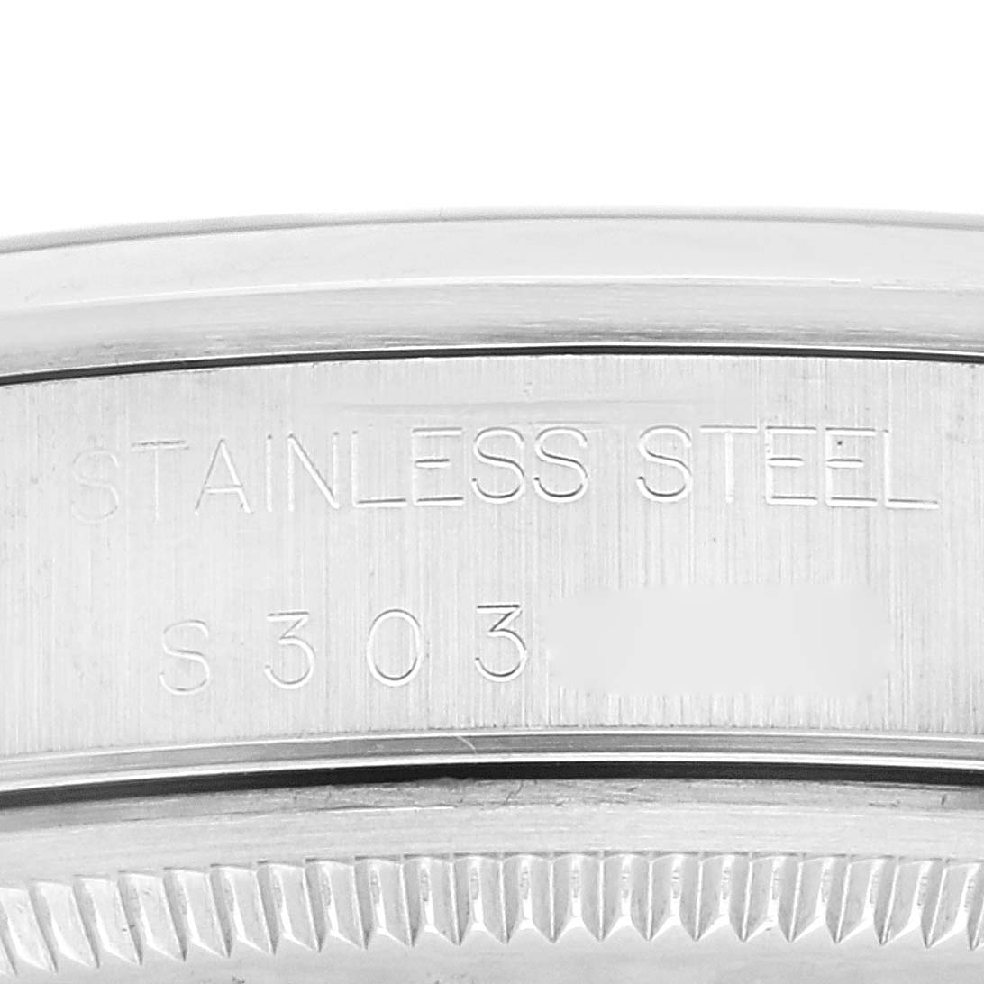 This close-up image shows the stainless steel case back inscription of a Rolex Air-King 14000 Men's Stainless Steel Black Dial 14000 Men's Stainless Steel Black Dial watch.