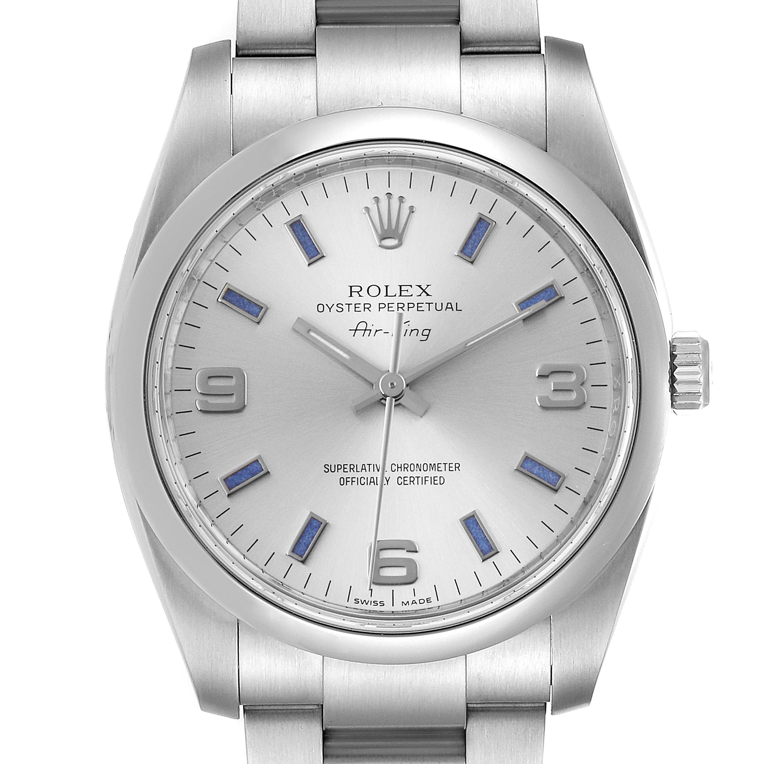 The Rolex Air-King 114200 Men's Stainless Steel Silver Dial 114200 Men's Stainless Steel Silver Dial watch is shown from a frontal angle, highlighting the dial, hour markers, and part of the bracelet.
