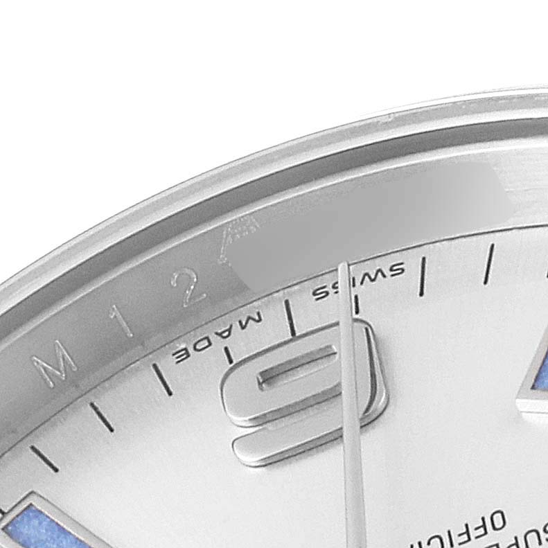 The image shows a close-up of the upper-left quadrant of a Rolex Air-King 114200 Men's Stainless Steel Silver Dial 114200 Men's Stainless Steel Silver Dial watch, highlighting the 9 o'clock marker and partial branding.