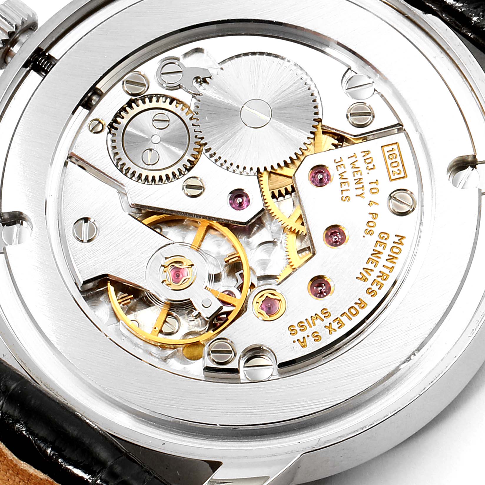 This image shows the back view of the Rolex Cellini 5116 Men's White Gold Black Dial 5116 Men's White Gold Black Dial watch, highlighting its intricate mechanical movement and gears.