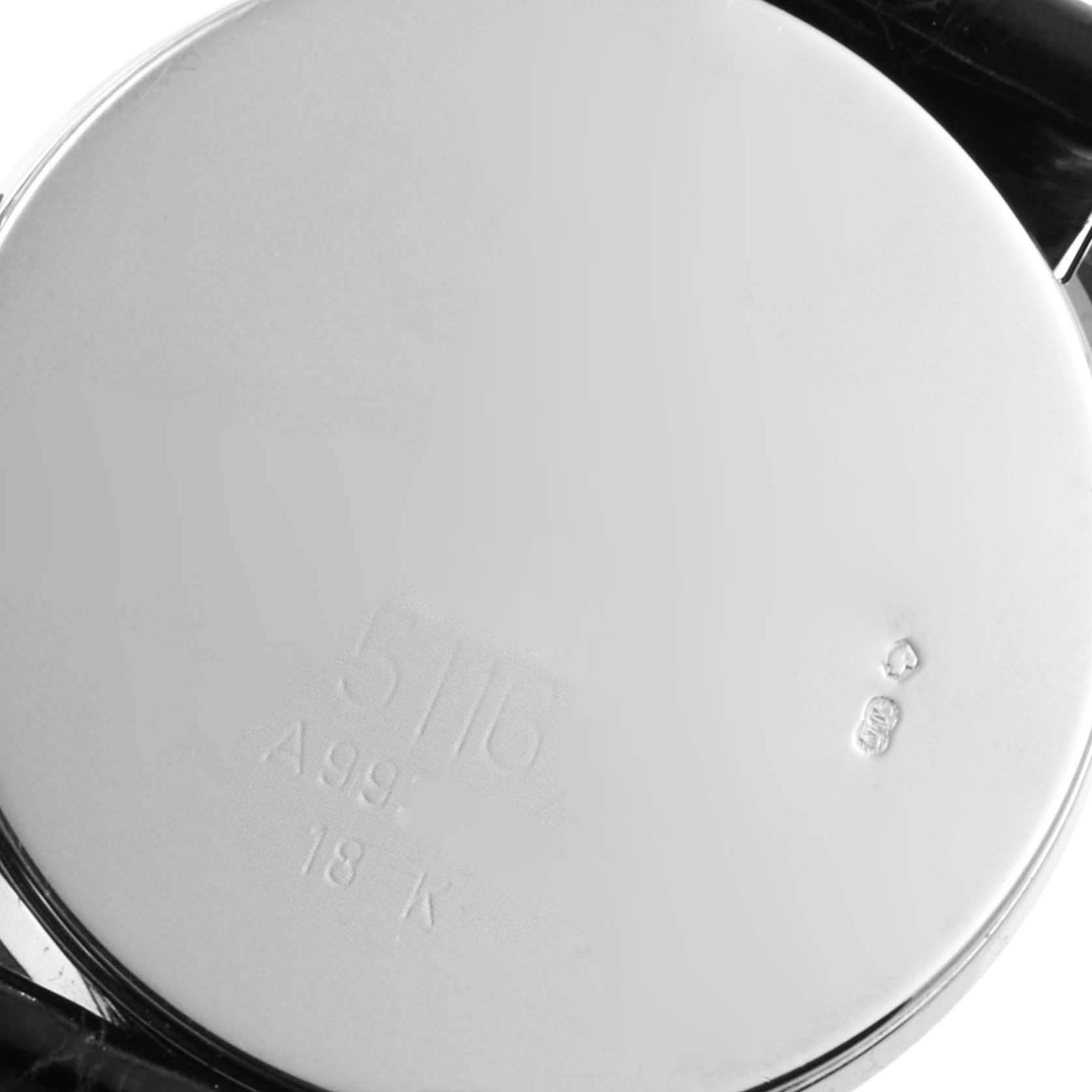 The image shows the back of the Rolex Cellini 5116 Men's White Gold Black Dial 5116 Men's White Gold Black Dial watch, highlighting engravings and part of the case.