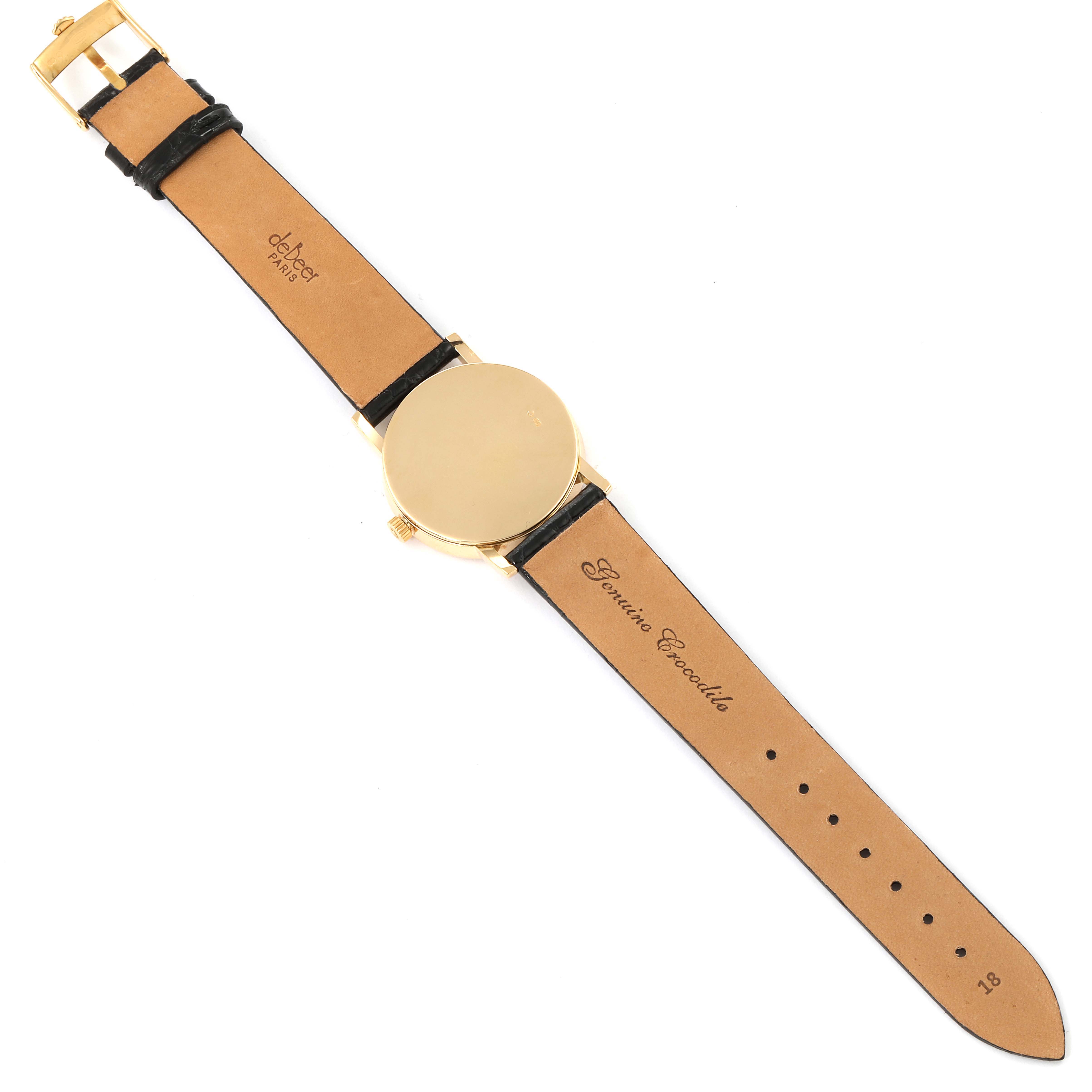 This image shows the back of a Rolex Cellini 5115 Men's Yellow Gold Black Dial 5115 Men's Yellow Gold Black Dial watch, featuring a gold case and a brown leather strap.