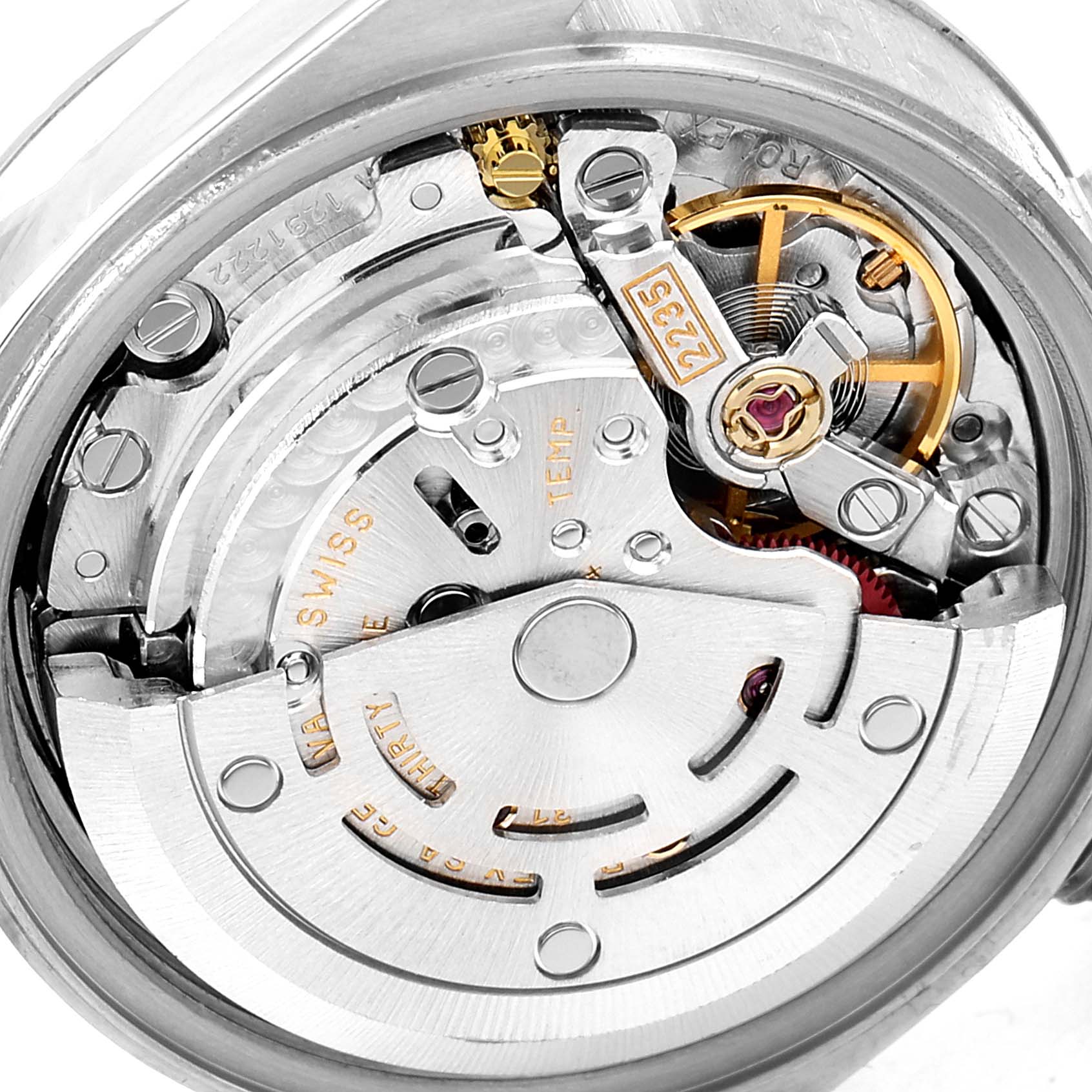 The image shows the intricate internal mechanism and movement parts of a Rolex Datejust 79173 Women
s Steel and Gold (two tone) Grey Dial 79173 Women
s Steel and Gold (two tone) Grey Dial watch from a close-up angle.