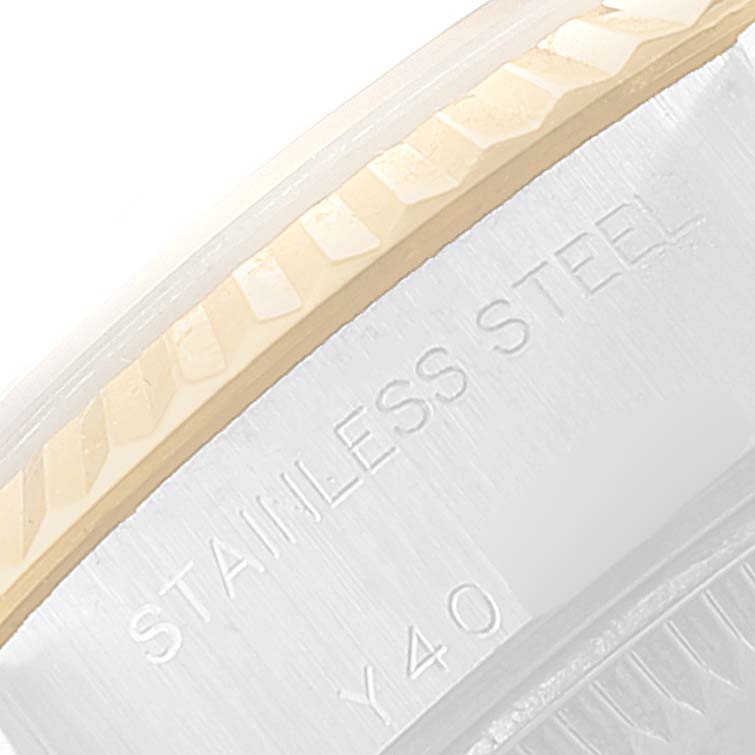 This image shows a close-up angle of the bezel and stainless steel casing of a Rolex Datejust 79173 Women
s Steel and Gold (two tone) Grey Dial 79173 Women
s Steel and Gold (two tone) Grey Dial watch.