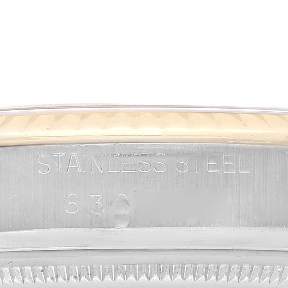 This image shows a close-up of the stainless steel bezel and engraving of a Rolex Vintage Collection 16013 Men's Steel and Gold (two tone) Black Dial 16013 Men's Steel and Gold (two tone) Black Dial watch.