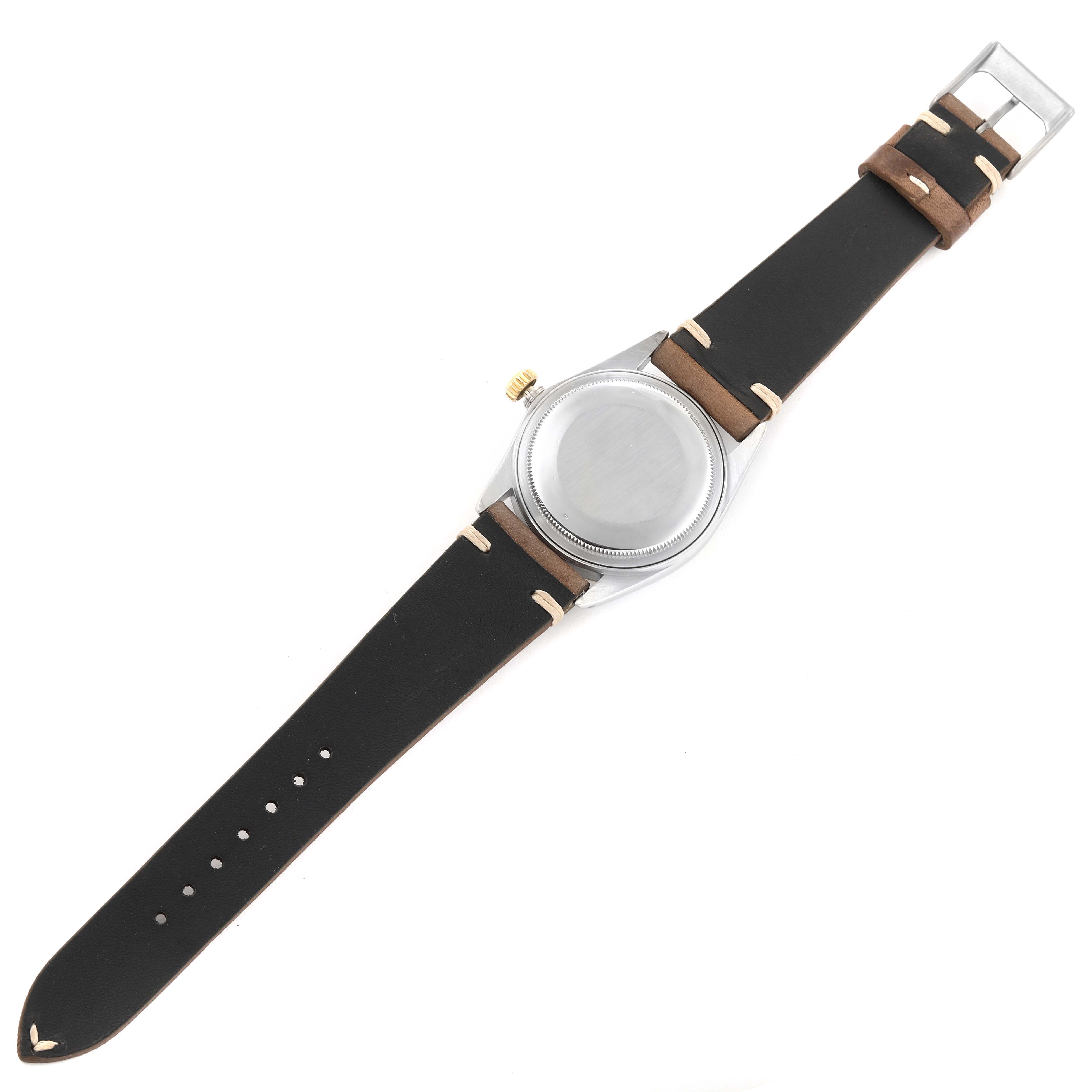 The image shows a Vintage Collection model by Rolex from the back, highlighting the strap, case, and buckle.