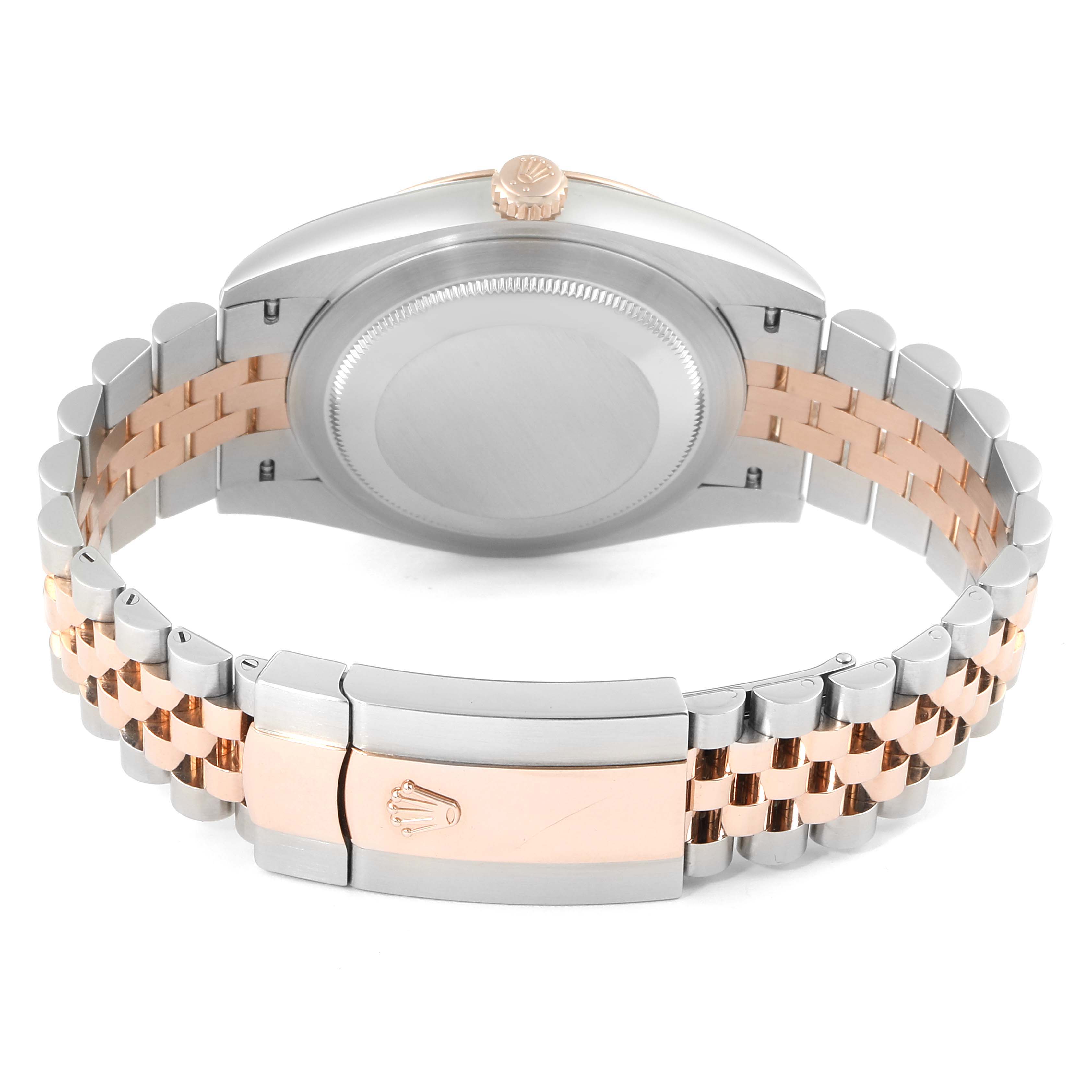 The image shows the back case and two-tone bracelet of the Rolex Datejust 41 126331 Men
s Rose Gold Brown Dial 126331 Men
s Rose Gold Brown Dial, along with the clasp bearing the Rolex logo.