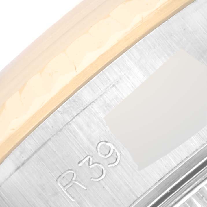 This image shows a close-up of the Rolex Datejust 69173G Women's Stainless Steel Champagne Dial 69173G Women's Stainless Steel Champagne Dial watch case part, revealing its bezel and inner markings.