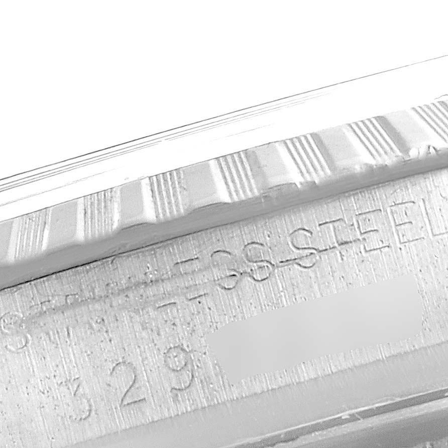 The image shows a close-up of the side of the bezel and the engraved text on the case of a Vintage Collection model by Rolex.