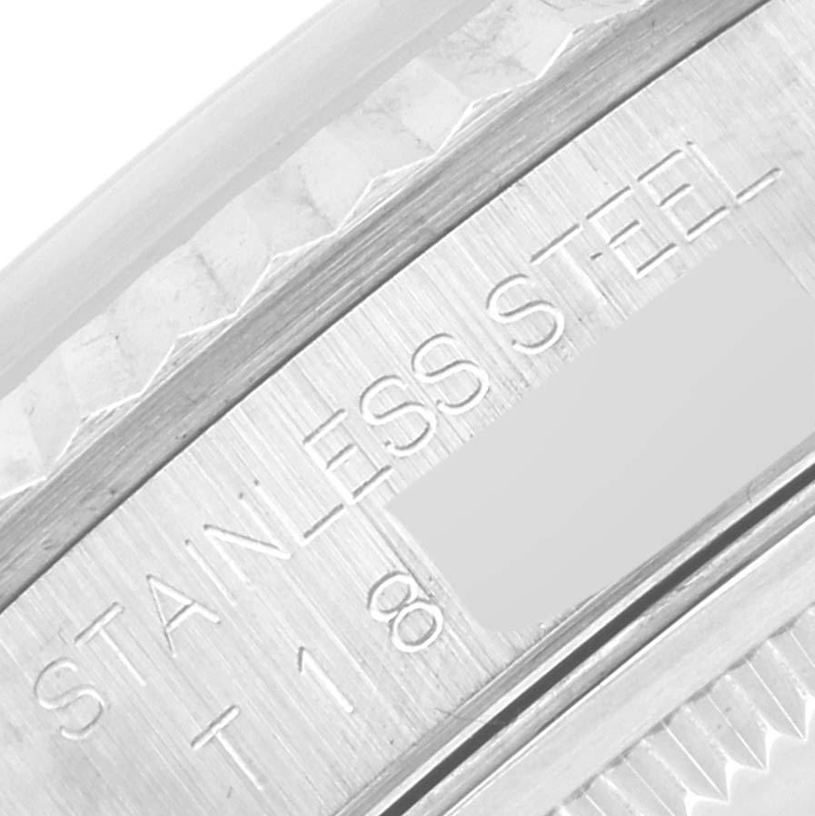 This close-up image shows the engraved text "STAINLESS STEEL" on the Rolex Datejust 16234 Men's Stainless Steel Silver Dial 16234 Men's Stainless Steel Silver Dial's case back edge.