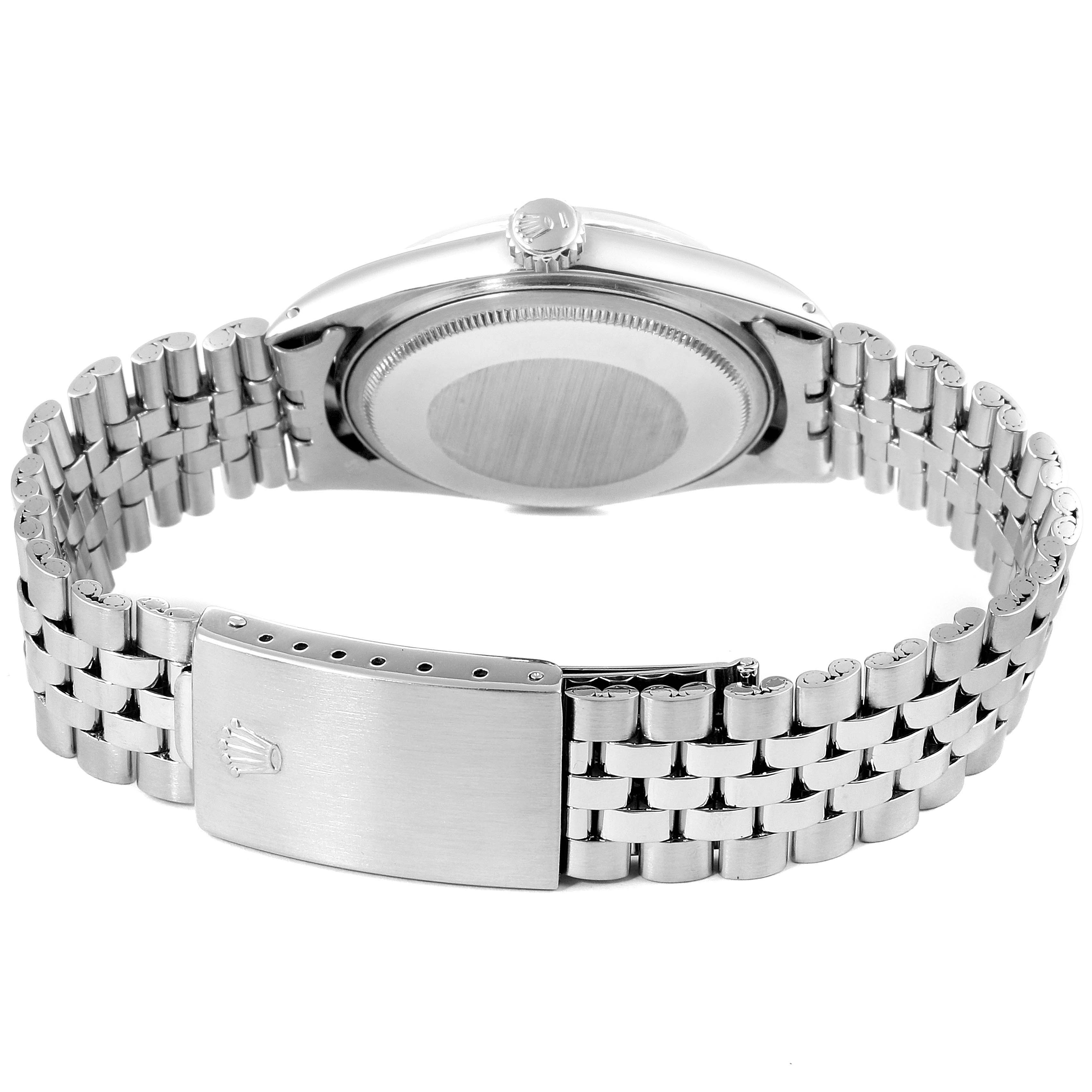 The image shows the back and side view of a Vintage Collection Rolex watch, highlighting the clasp and metal bracelet.