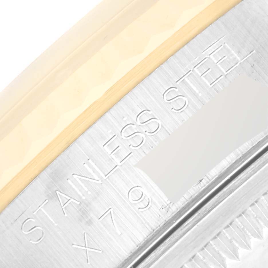 This image shows a close-up of the engraved text on the inner rim of a Rolex Datejust 16233 Men's Steel and Gold (two tone) White Dial 16233 Men's Steel and Gold (two tone) White Dial watch, indicating "STAINLESS STEEL."