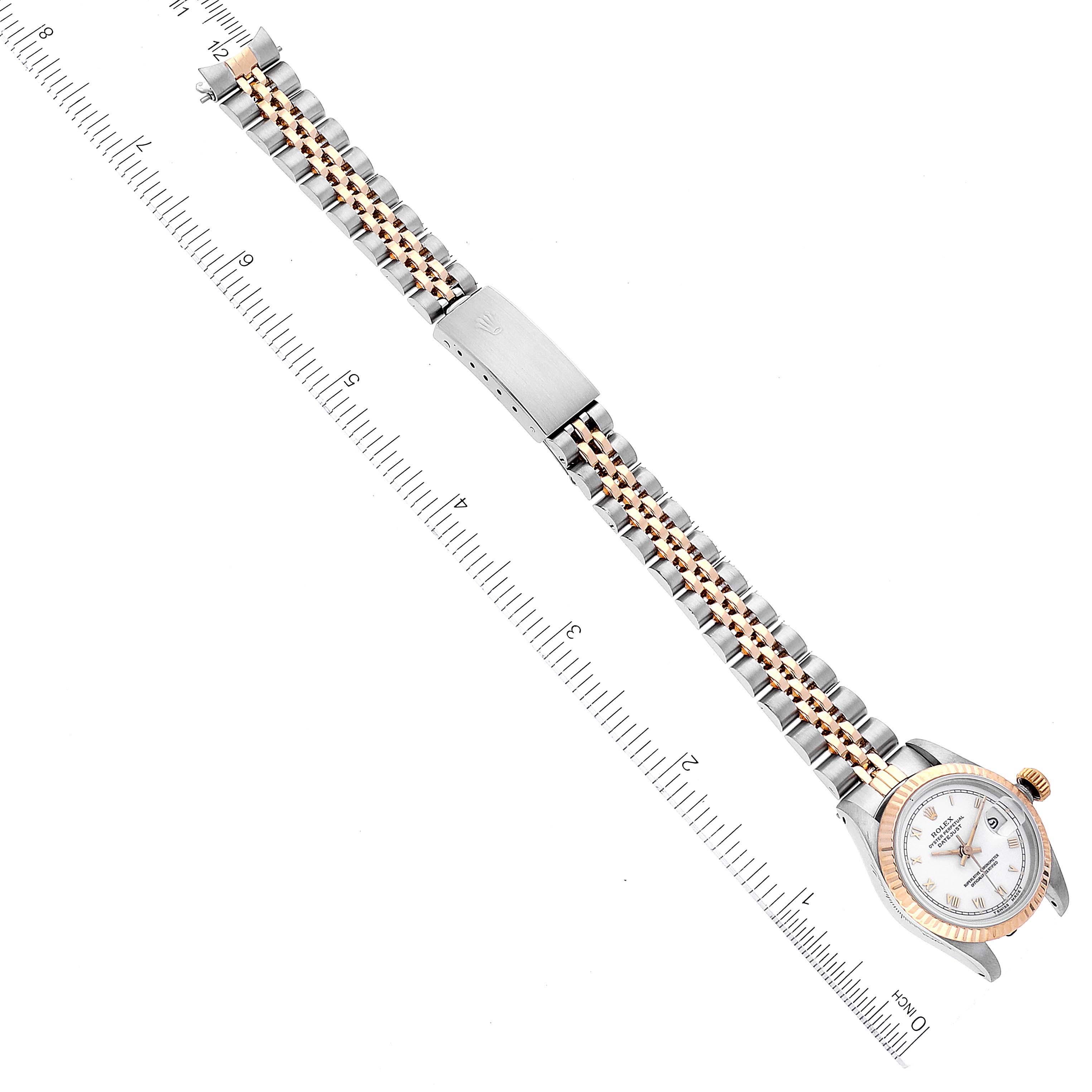 The image shows a Rolex Datejust 69173 Women's Steel and Gold (two tone) White Dial 69173 Women's Steel and Gold (two tone) White Dial watch laid flat, displaying its entire bracelet, clasp, dial, and case, with a ruler alongside for scale.