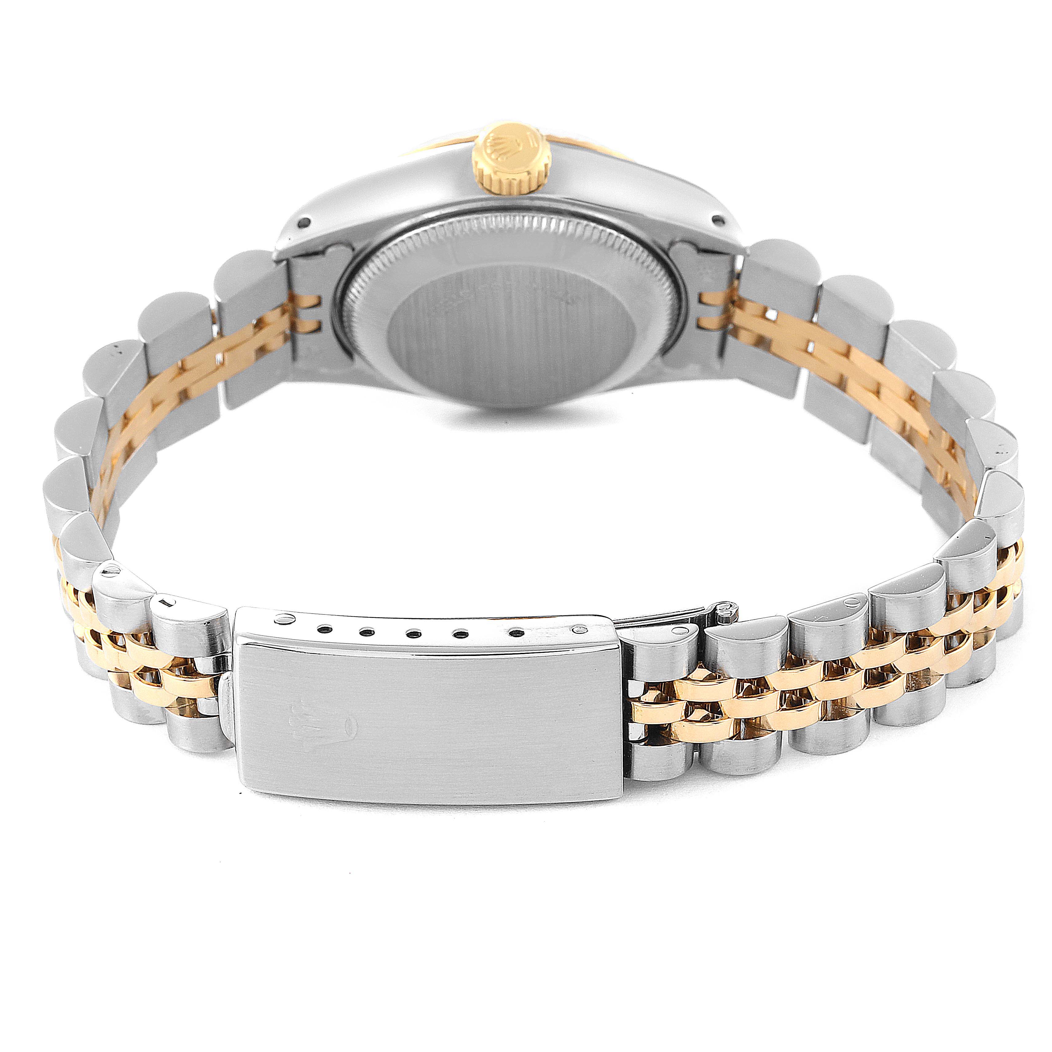 The image shows the back view of a Rolex Datejust 69173 Women's Steel and Gold (two tone) White Dial 69173 Women's Steel and Gold (two tone) White Dial watch, highlighting the case back, crown, and two-tone metal bracelet.