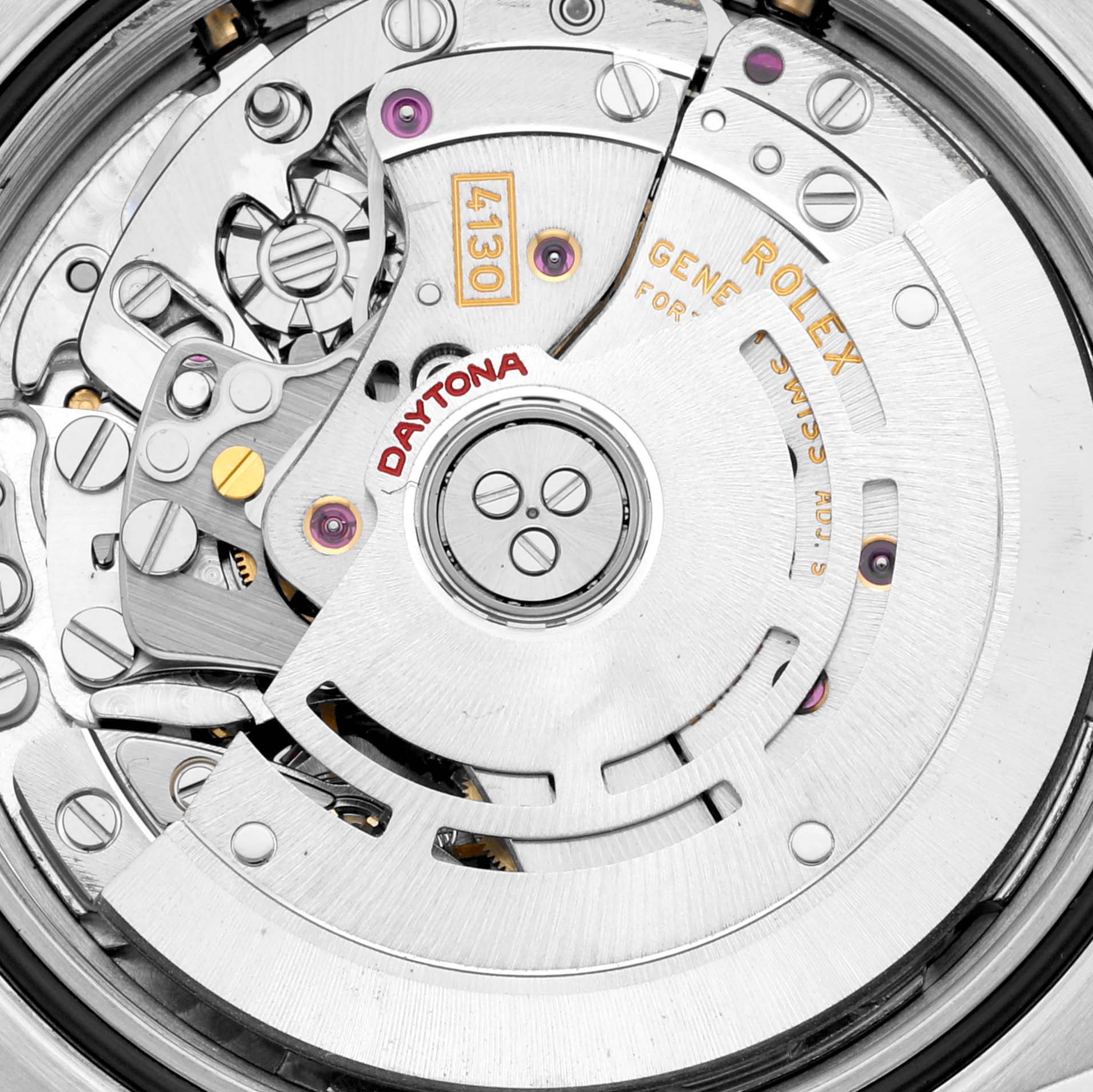 The image shows the intricate inner mechanism of a Rolex Daytona 116523G Men
s Steel and Gold (two tone) White Dial 116523G Men
s Steel and Gold (two tone) White Dial watch, highlighting gears and the rotor from a close-up angle.