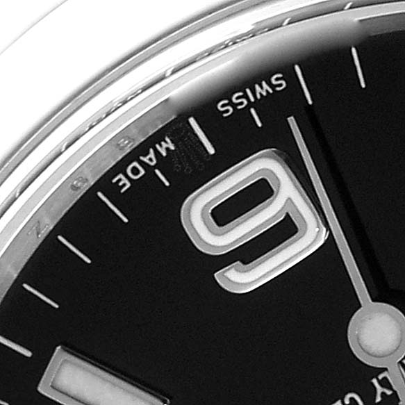 This is a close-up image of the dial of a Rolex Explorer 114270 Men's Stainless Steel Black Dial 114270 Men's Stainless Steel Black Dial watch, showing part of the "9" numeral, hour markers, and "Swiss Made" text.