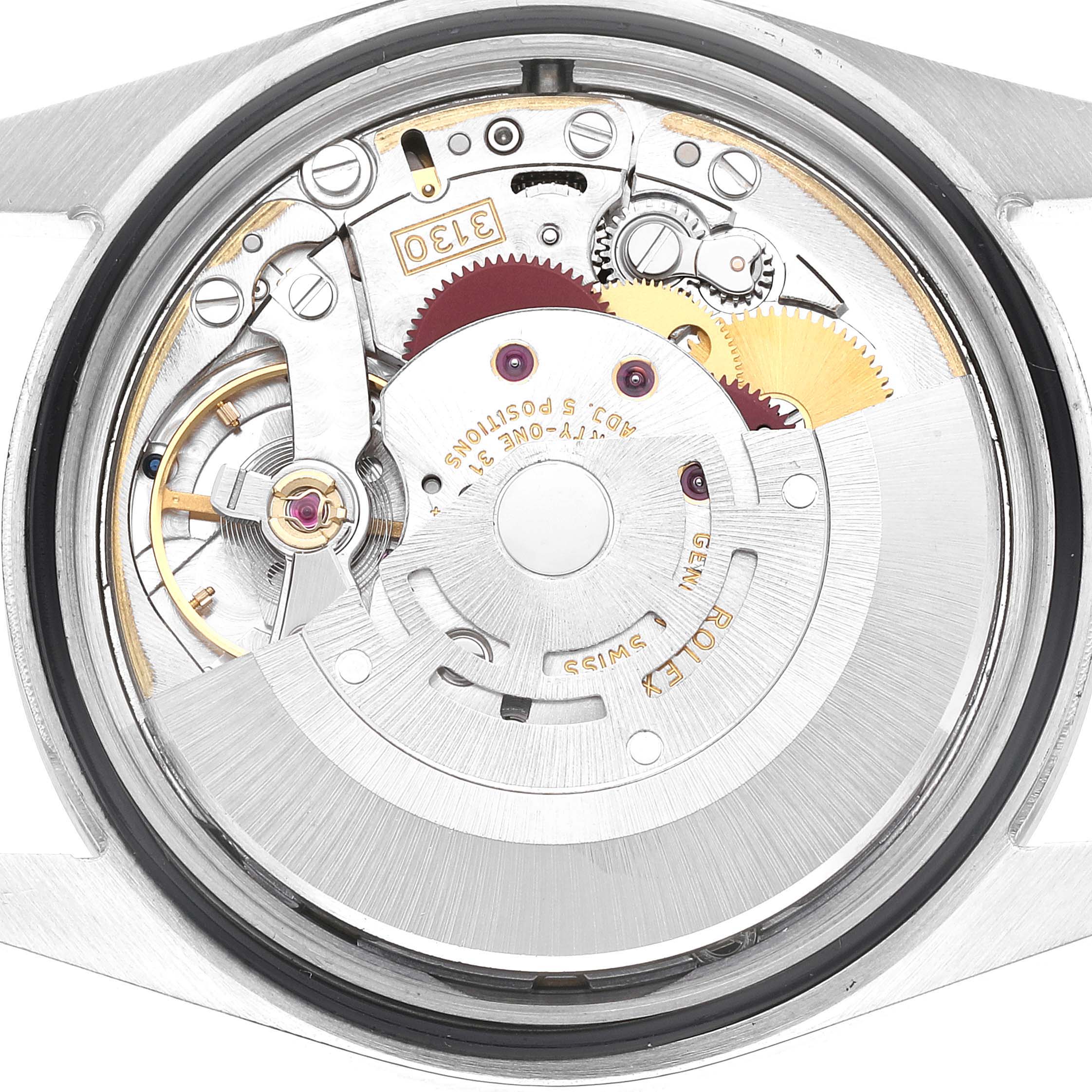 The image shows the internal mechanical movement of the Rolex Explorer 114270 Men's Stainless Steel Black Dial 114270 Men's Stainless Steel Black Dial, focusing on the intricate gears and components.