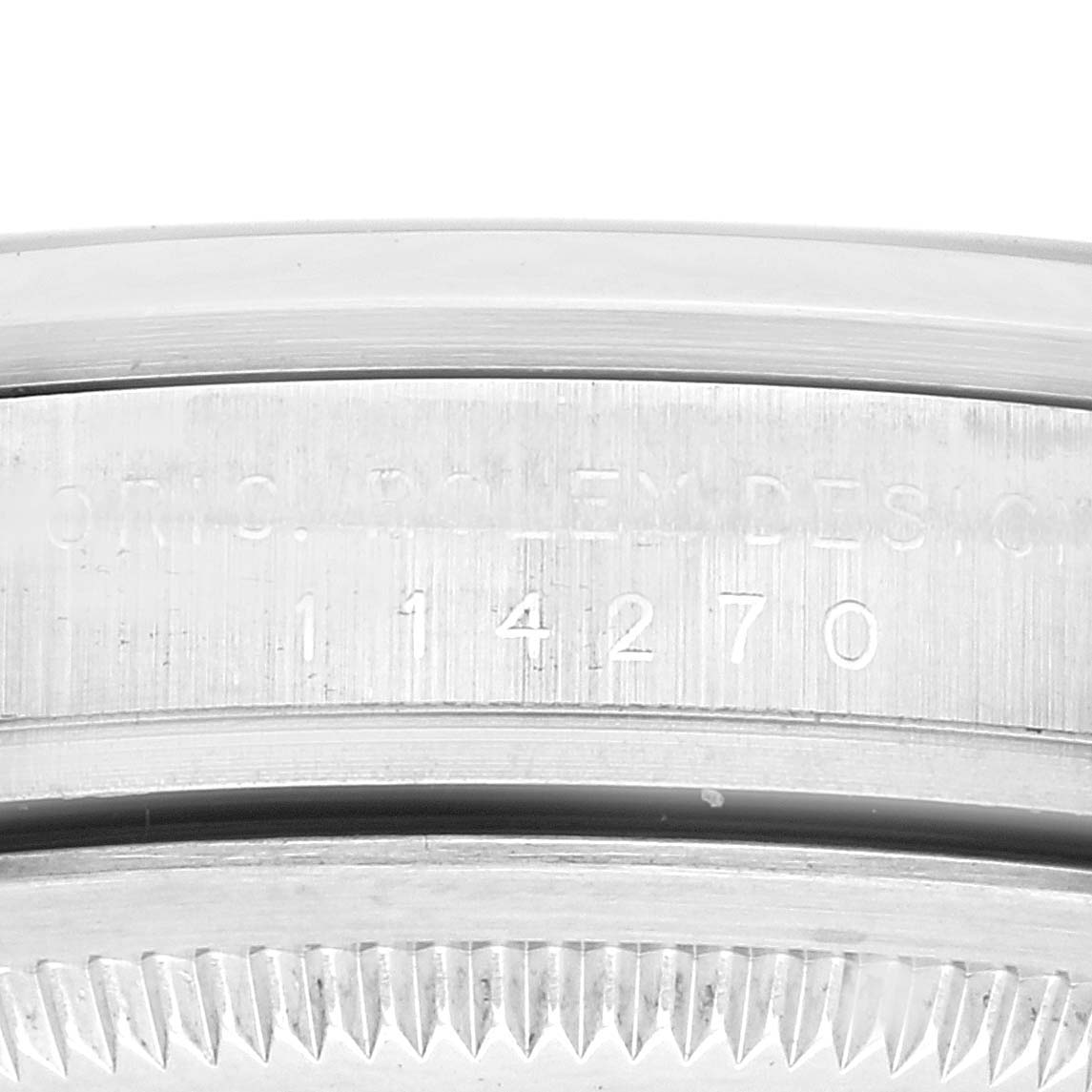This image shows a close-up of the case side engraving and bezel teeth of a Rolex Explorer 114270 Men's Stainless Steel Black Dial 114270 Men's Stainless Steel Black Dial watch.