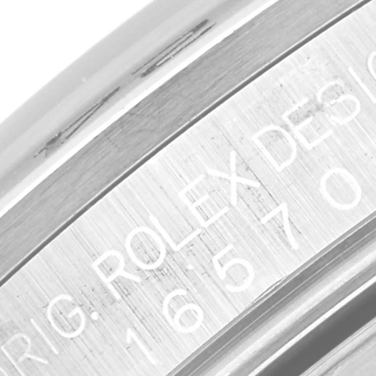 The image shows a close-up of the side of a Rolex Explorer 16570 Men's Stainless Steel White Dial 16570 Men's Stainless Steel White Dial watch with engraved model and brand details.