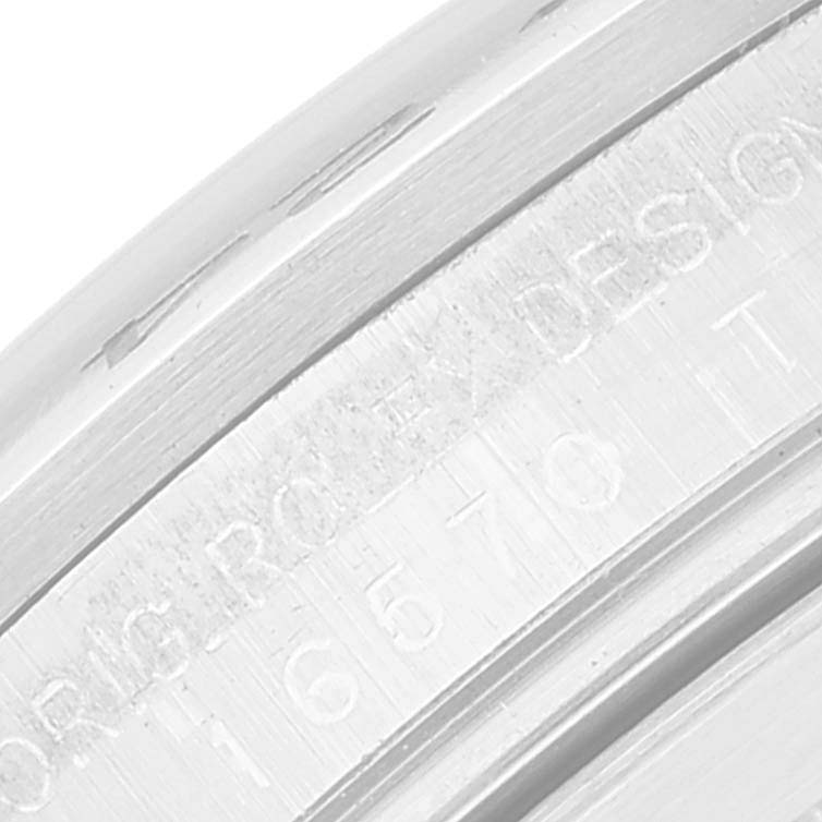 The image shows a close-up of the engraved serial and model number on the case of the Rolex Explorer 16570T Men's Stainless Steel White Dial 16570T Men's Stainless Steel White Dial watch.