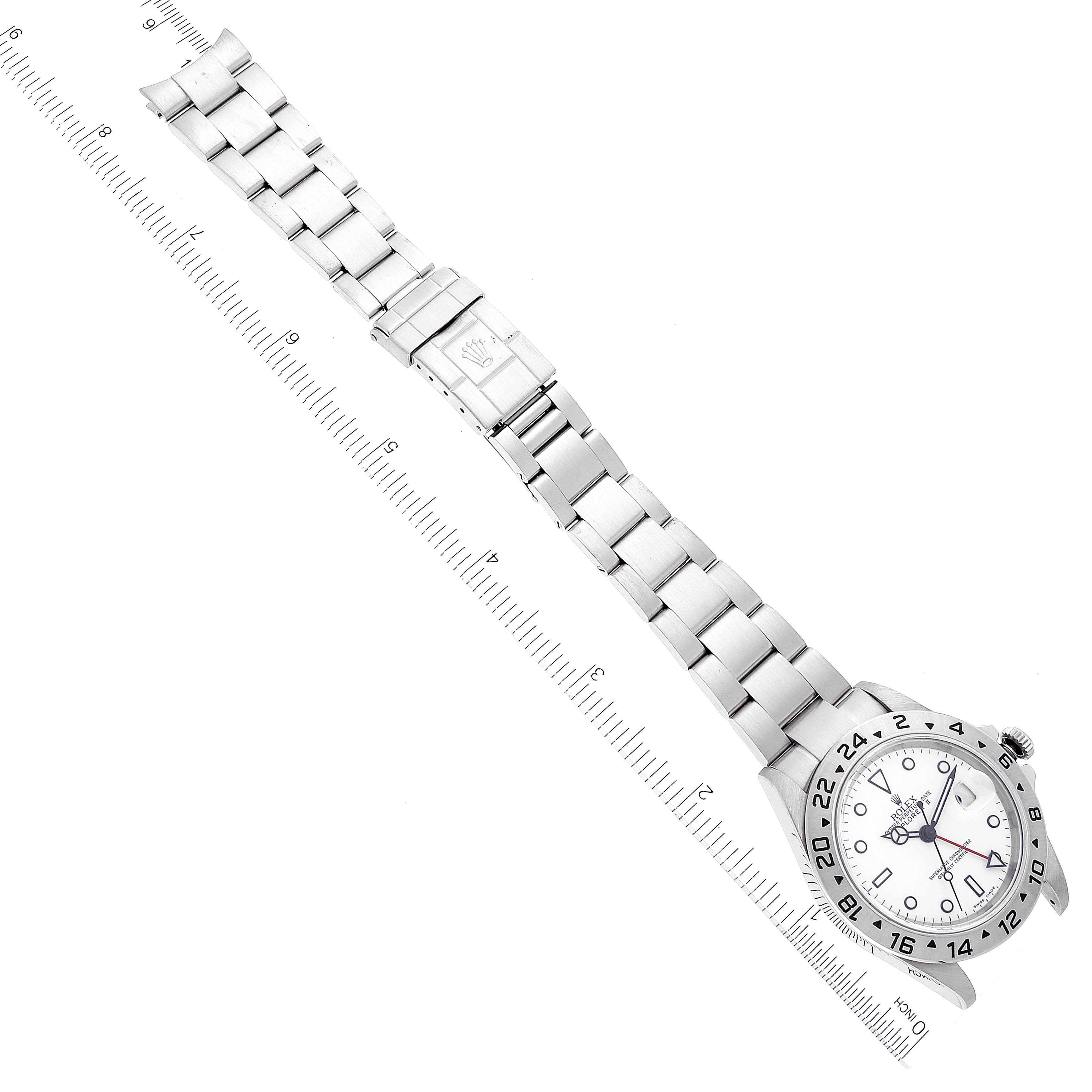 The image shows a full view of a Rolex Explorer 16570T Men's Stainless Steel White Dial 16570T Men's Stainless Steel White Dial watch, laid out flat alongside a measuring ruler.