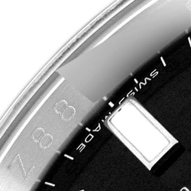 The image shows a close-up of the dial and bezel of a Rolex GMT-Master 116710 Men
s Stainless Steel Black Dial 116710 Men
s Stainless Steel Black Dial, displaying the "Swiss Made" text and part of the 8-hour marker.